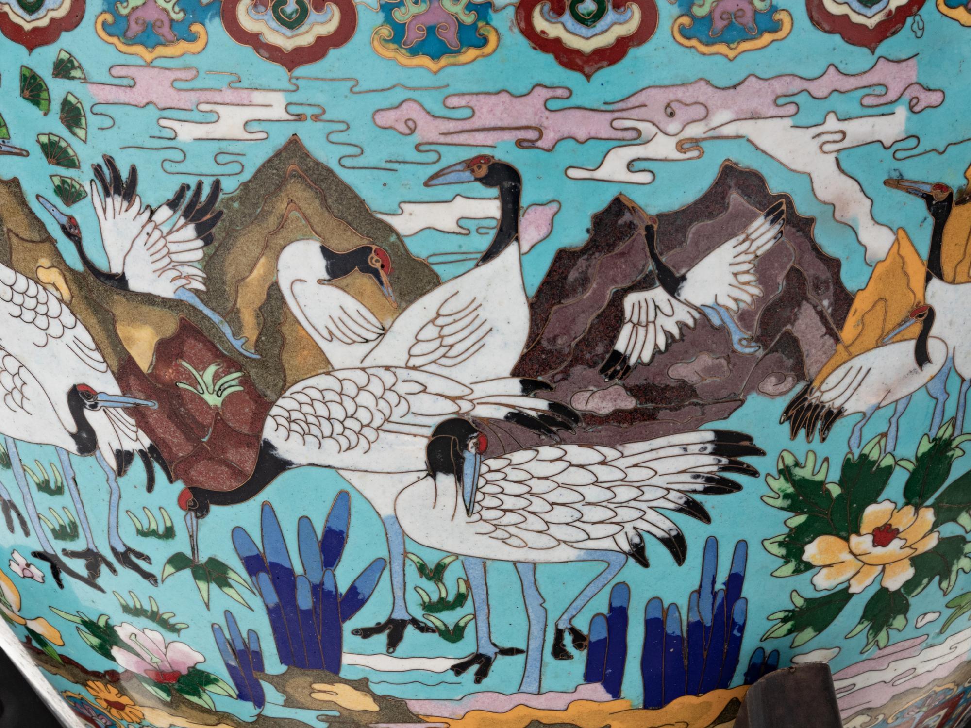 A Pair of Chinese Cloisonné Urns on Wood Stands