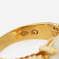 An 18K Yellow Gold, Diamond, and Opal Ring