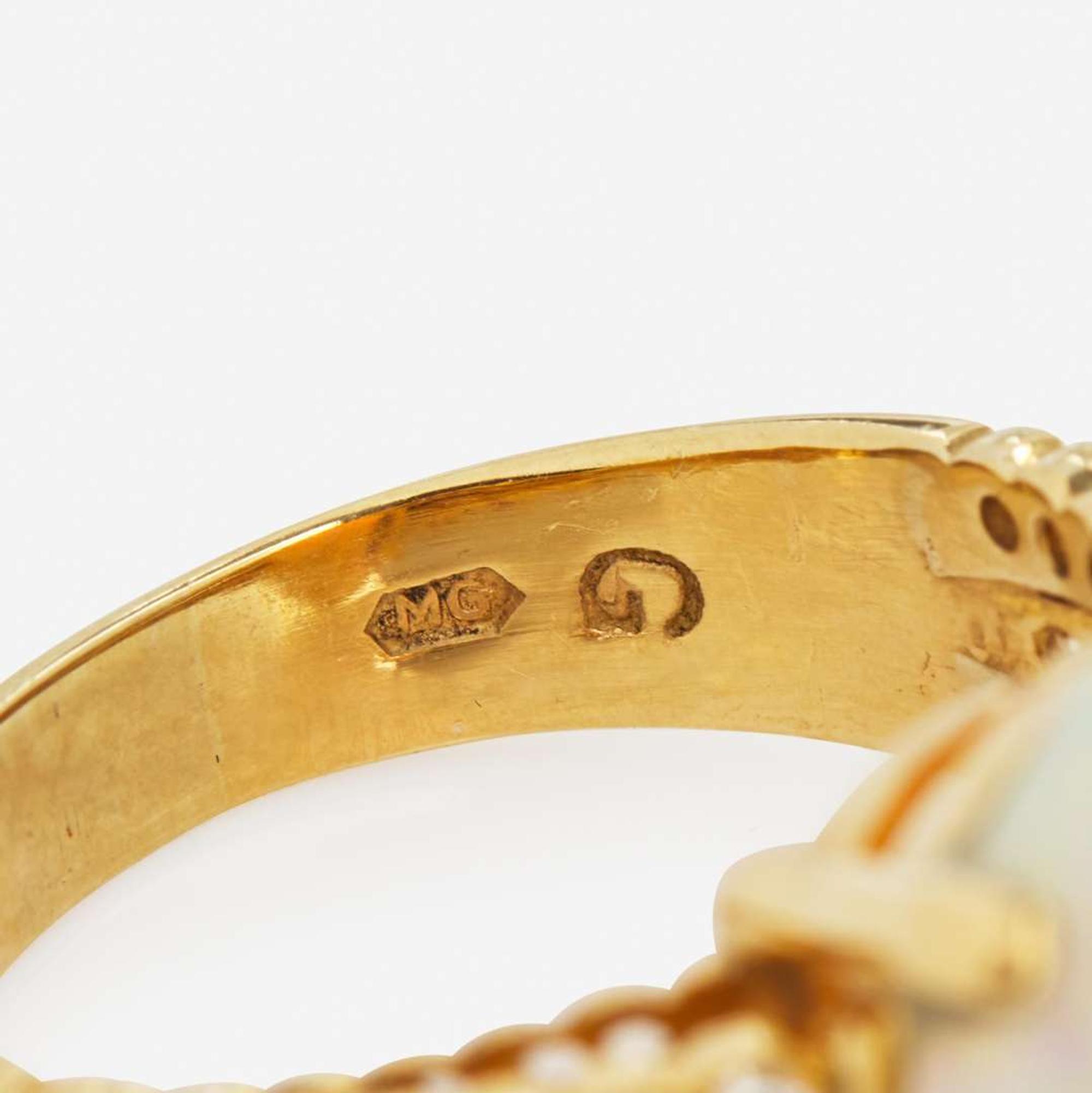 An 18K Yellow Gold, Diamond, and Opal Ring