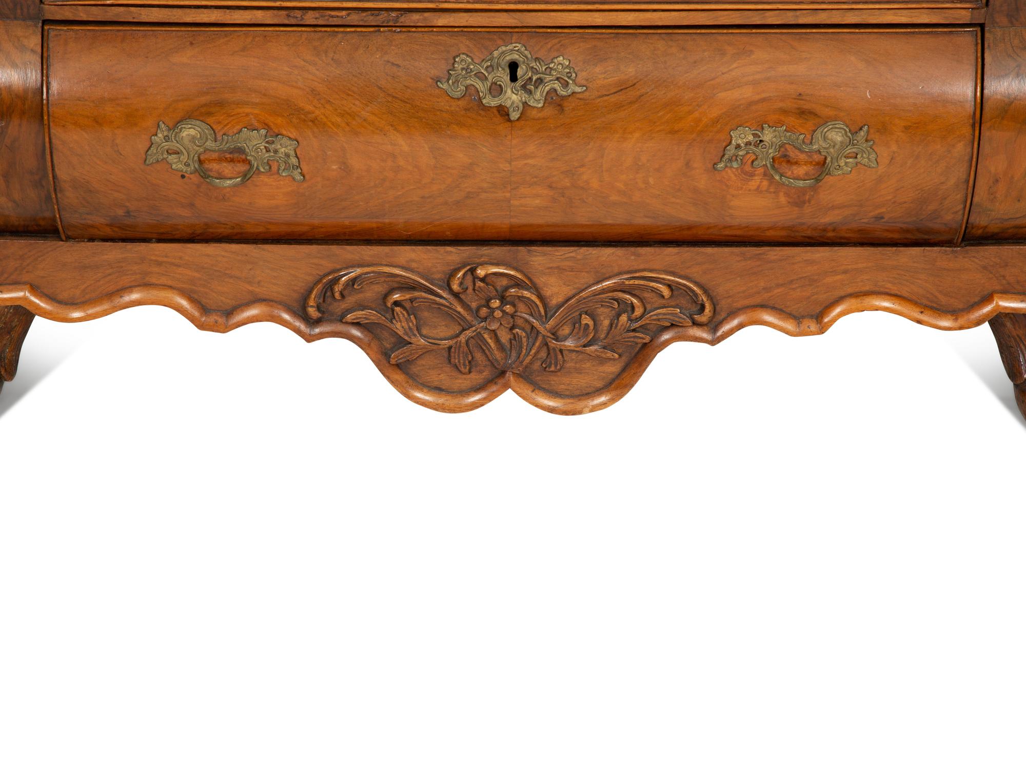 A Dutch Walnut Bombé Chest of Drawers