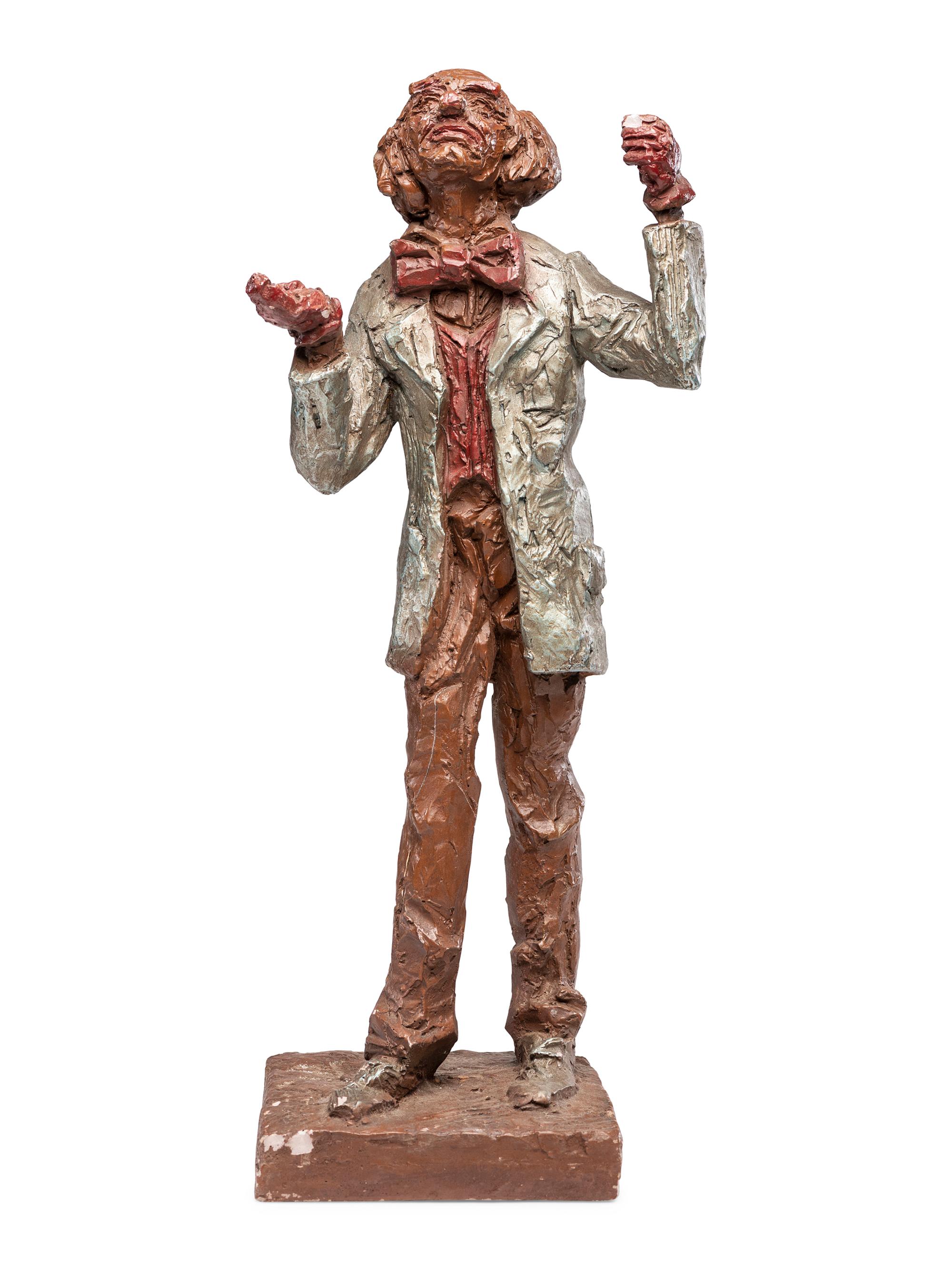 A Carved and Painted Plaster Folk Art Sculpture of a Standing Man