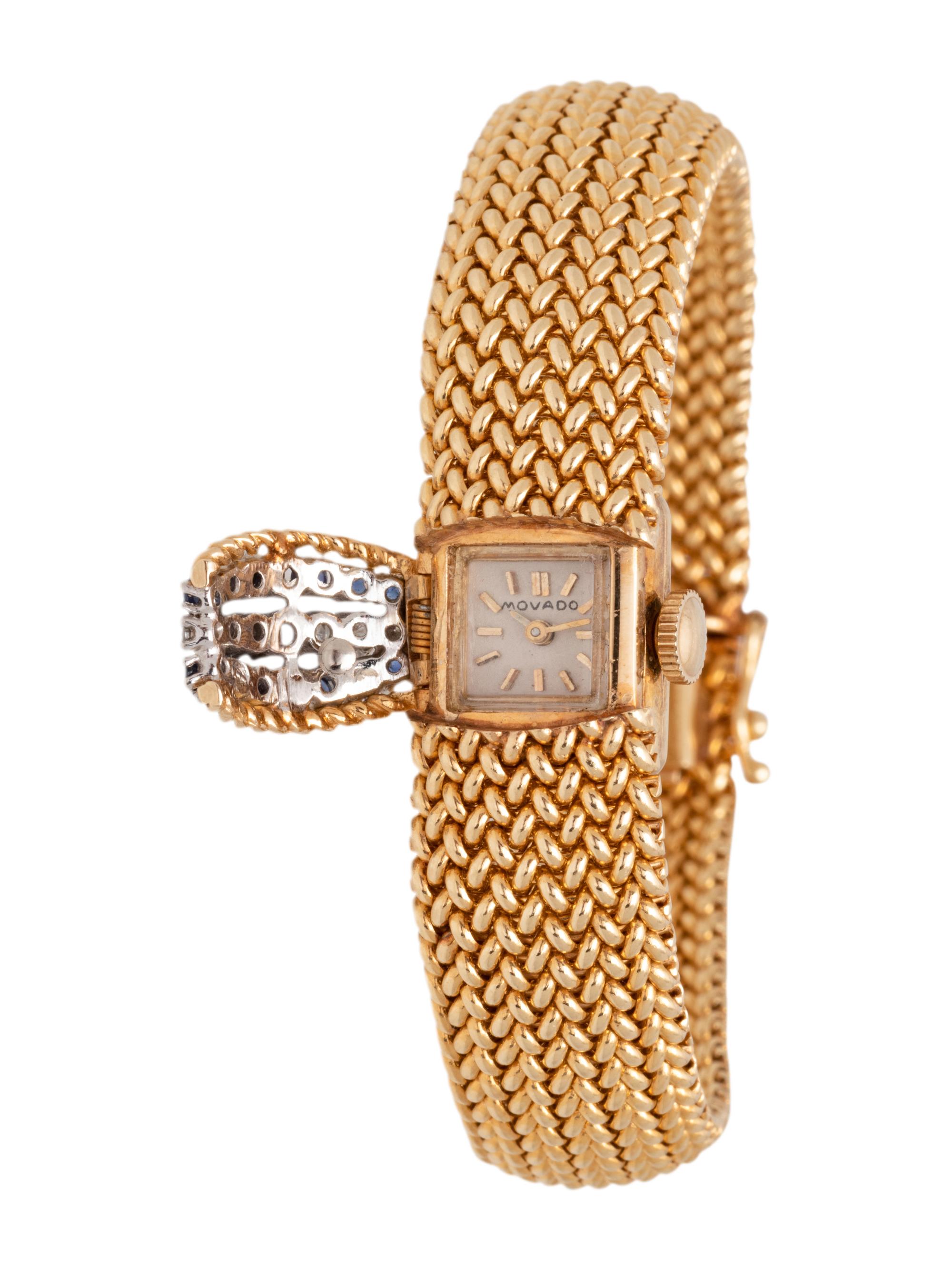 MOVADO, 14K YELLOW GOLD, DIAMOND AND SAPPHIRE SURPRISE WRISTWATCH