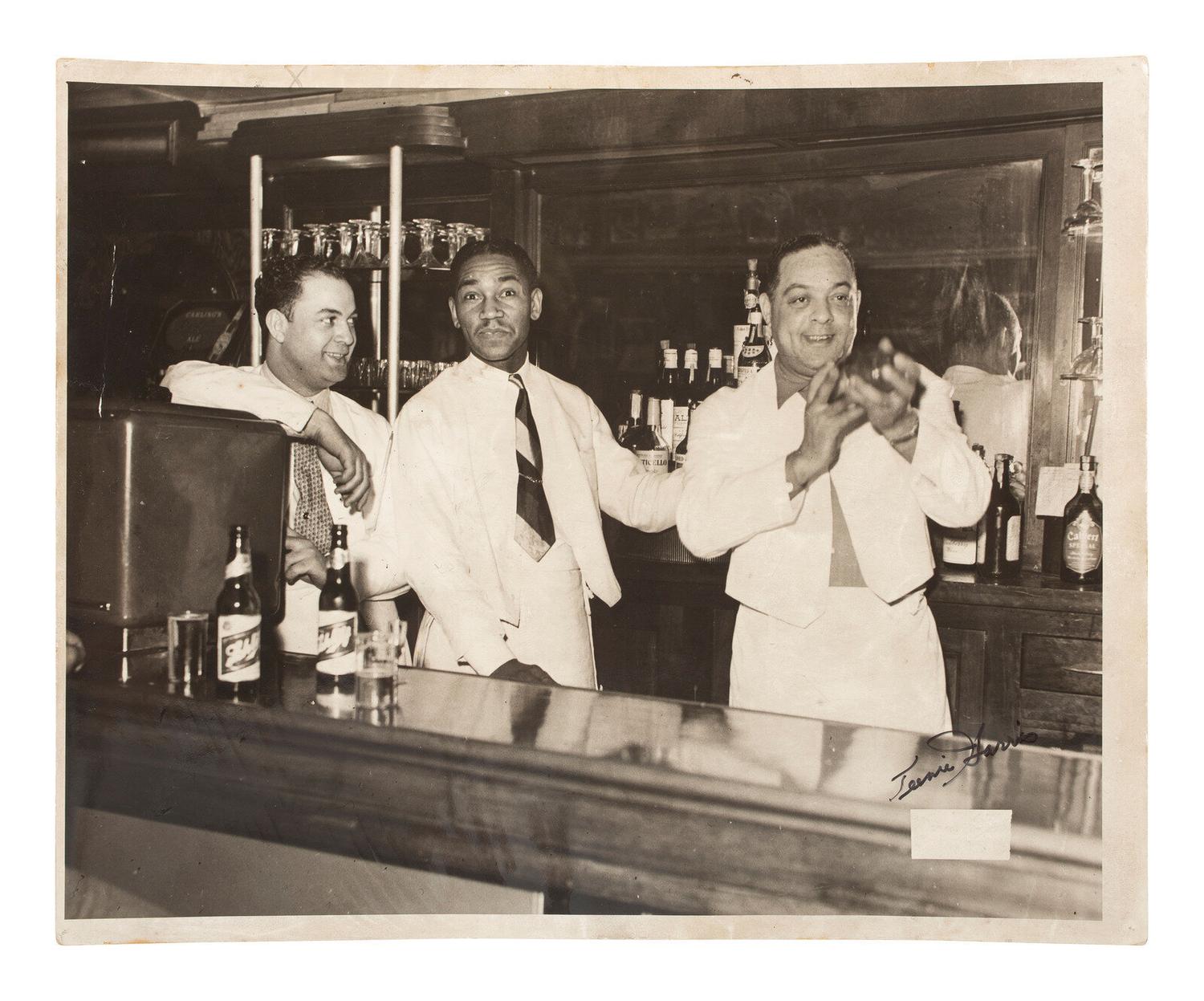[PHOTOGRAPHY]. HARRIS, Charles "Teenie," (1908-1998). Photograph of a trio of bartenders. Ca 1950.