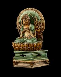 A Chinese Sancai Glazed Stoneware Figure of Seated Guanyin