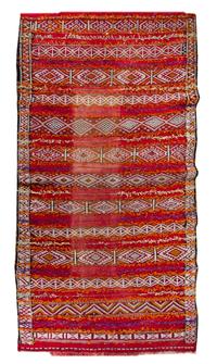 An Afghan Wool Rug 10 feet 1 inch x 5 feet 6 inches. — 20TH CENTURY