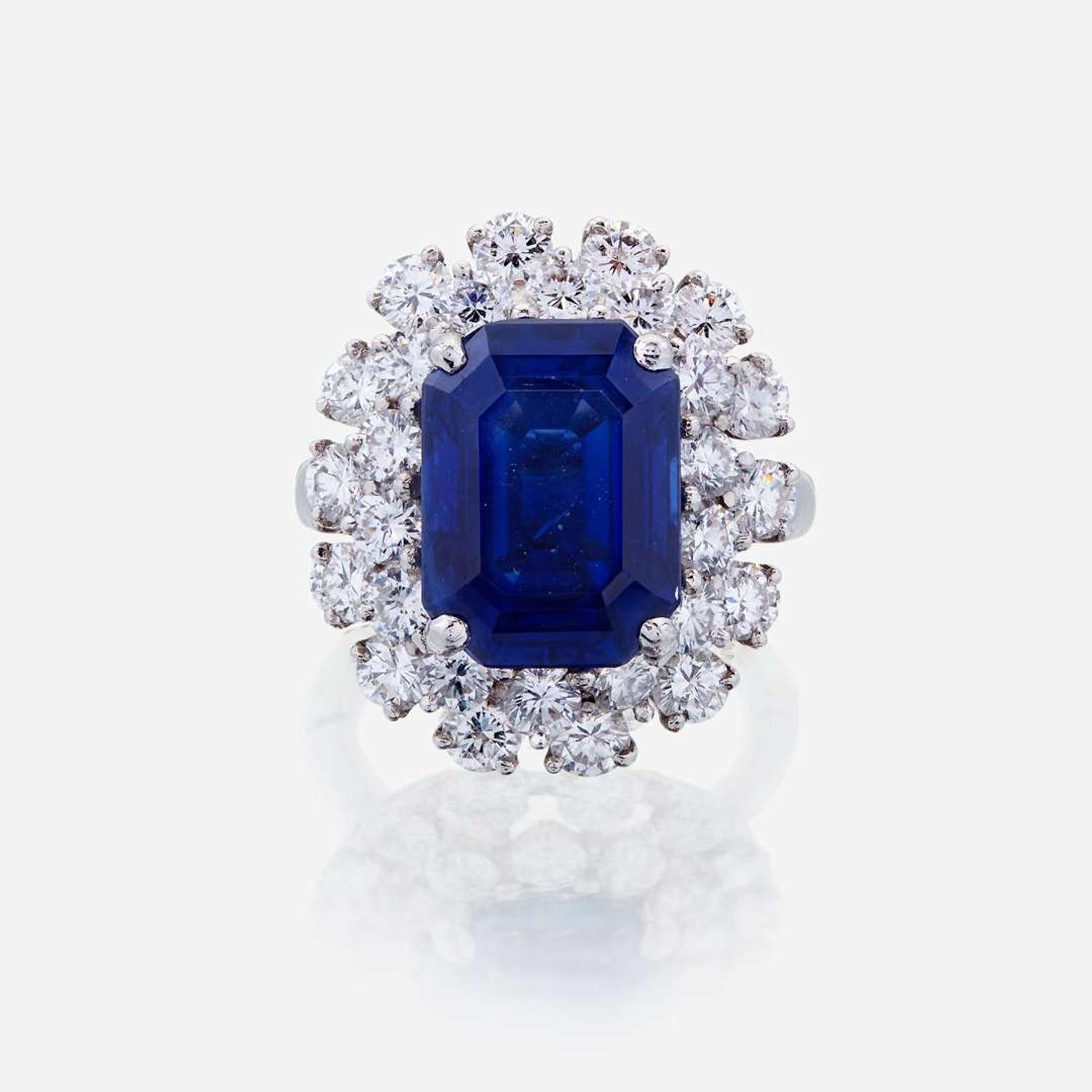 A sapphire, diamond, and fourteen karat white gold ring