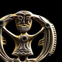 A Migration Period Gilt-Silver Brooch with Odin
