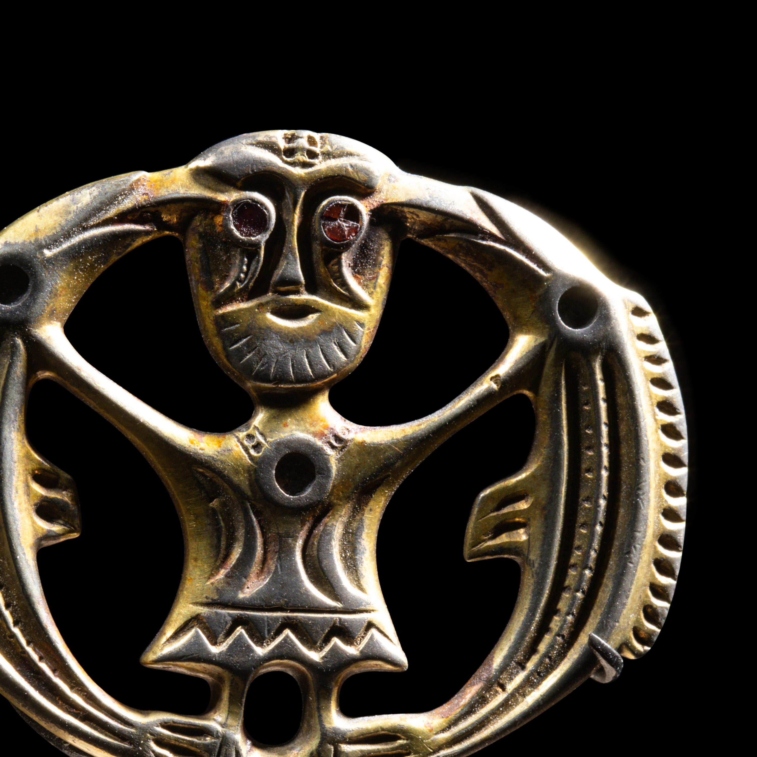 A Migration Period Gilt-Silver Brooch with Odin