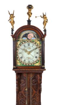 A Dutch Carved Oak Bracket Clock, Height 60 inches.