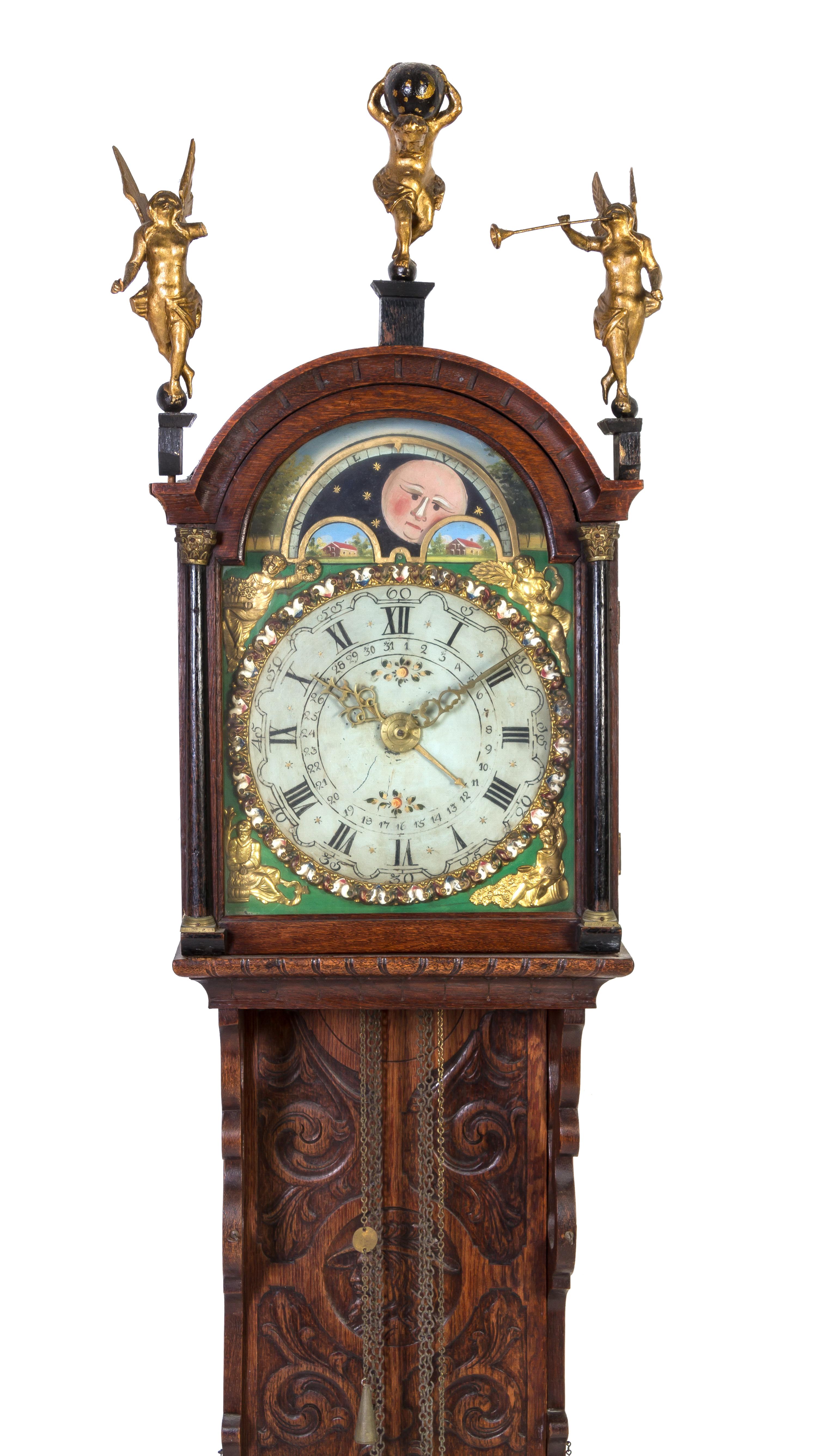 A Dutch Carved Oak Bracket Clock, Height 60 inches.