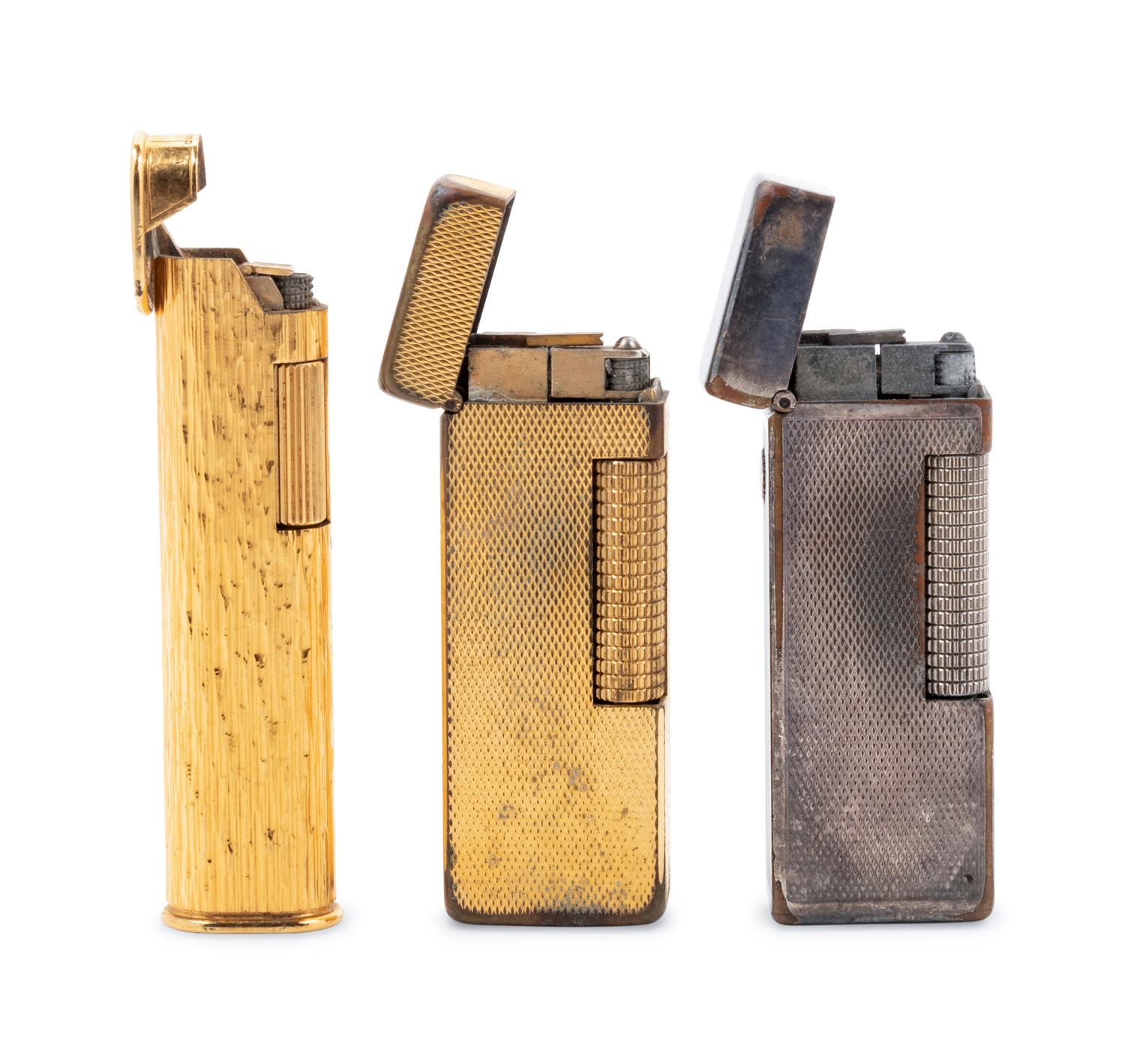 A Group of Three Dunhill Lighters