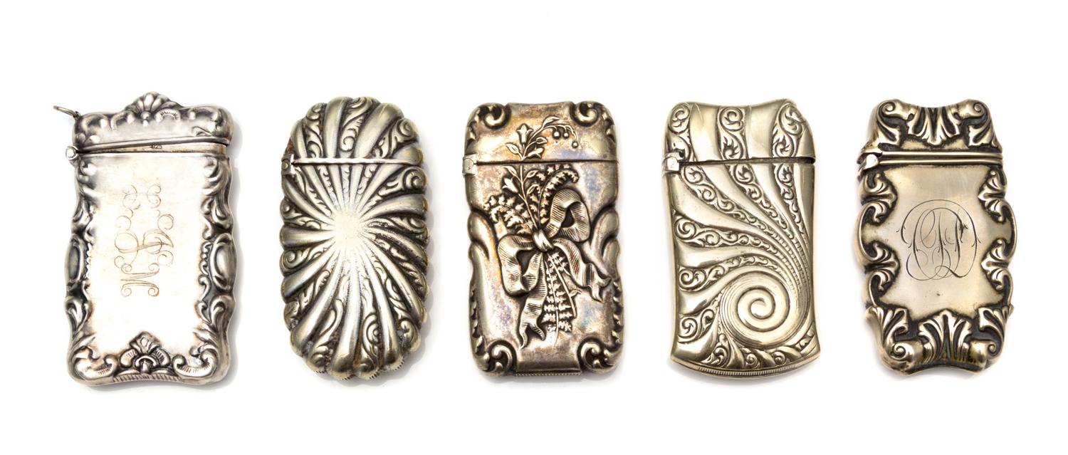 A Collection of Five American Vesta Cases, Various Makers, comprising a silver example having a rocaille and C-scroll decorated border,