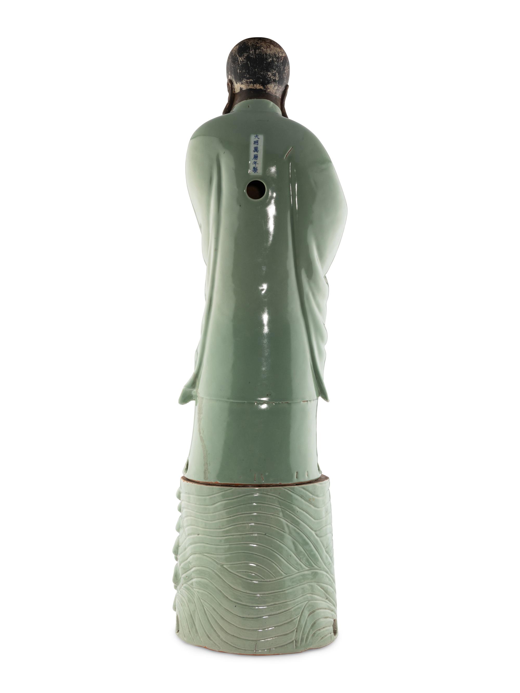 A Large Chinese Celadon Glazed Porcelain Figure of Damo