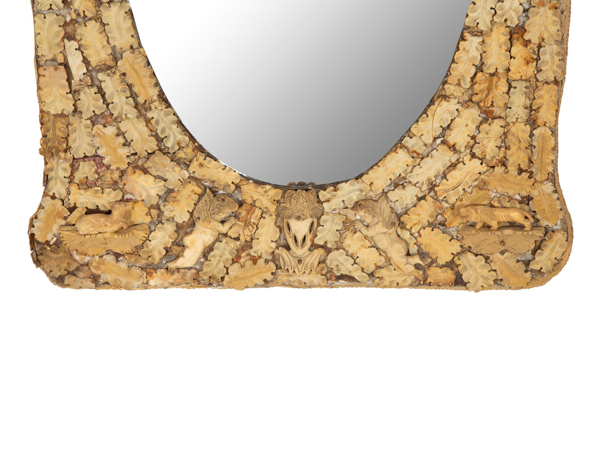 A Continental Carved Bone Mirror