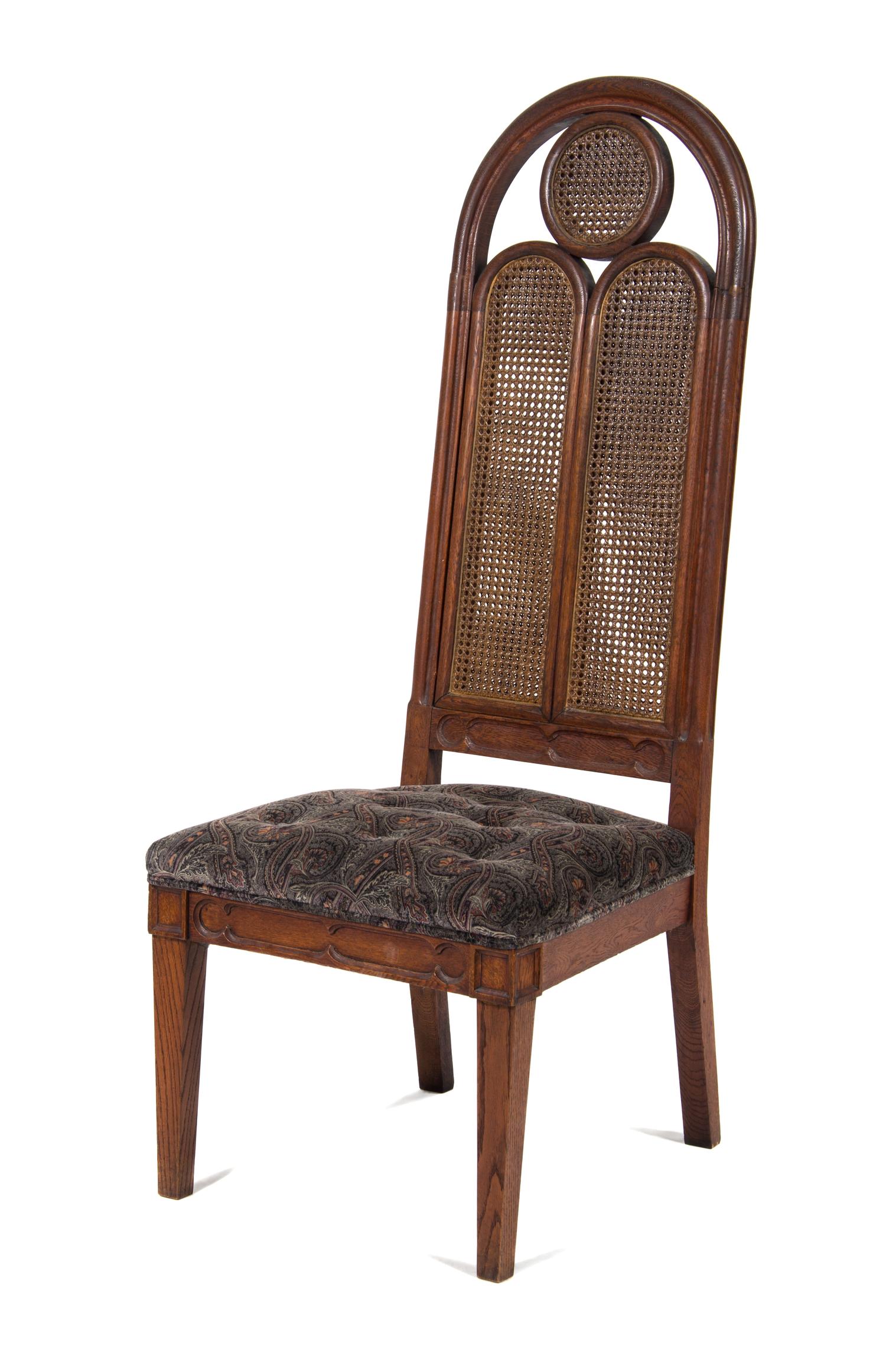A Gothic Revival Style Carved Oak Chair Height 58 inches. — 20TH CENTURY