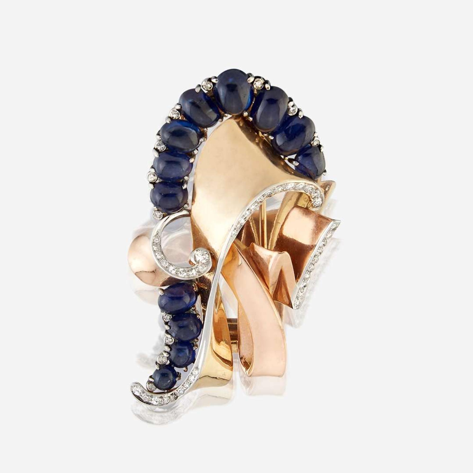 A Retro sapphire, diamond, and fourteen karat gold brooch circa 1940s