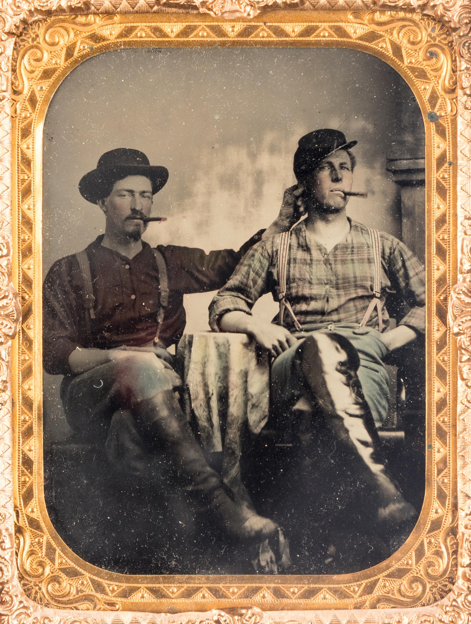 [CIVIL WAR]. Quarter plate tintype featuring a playful portrait of identified 7th Iowa Infantry pards in Corinth, MS.