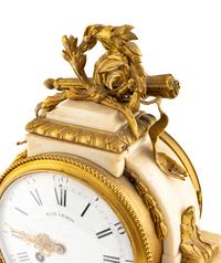 A Louis XVI Style Gilt Bronze Mounted Marble Mantel Clock