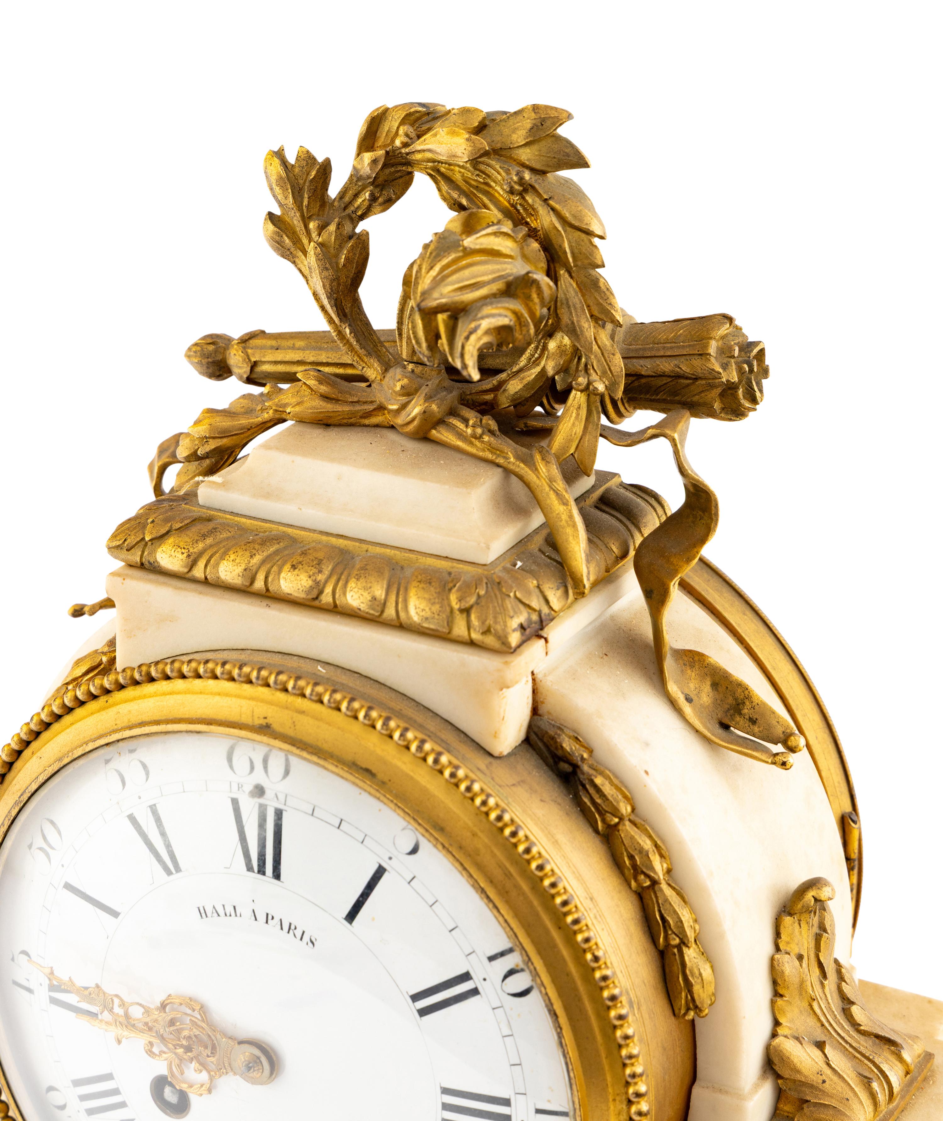 A Louis XVI Style Gilt Bronze Mounted Marble Mantel Clock