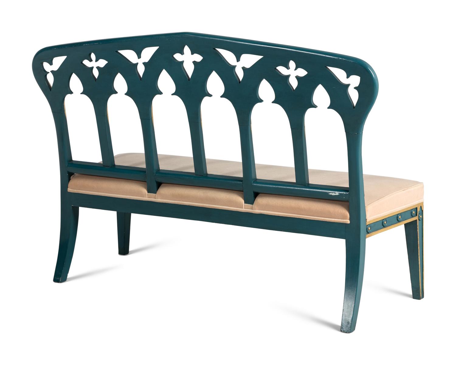 A Pair of English Gothic Revival Painted and Parcel Gilt Settees