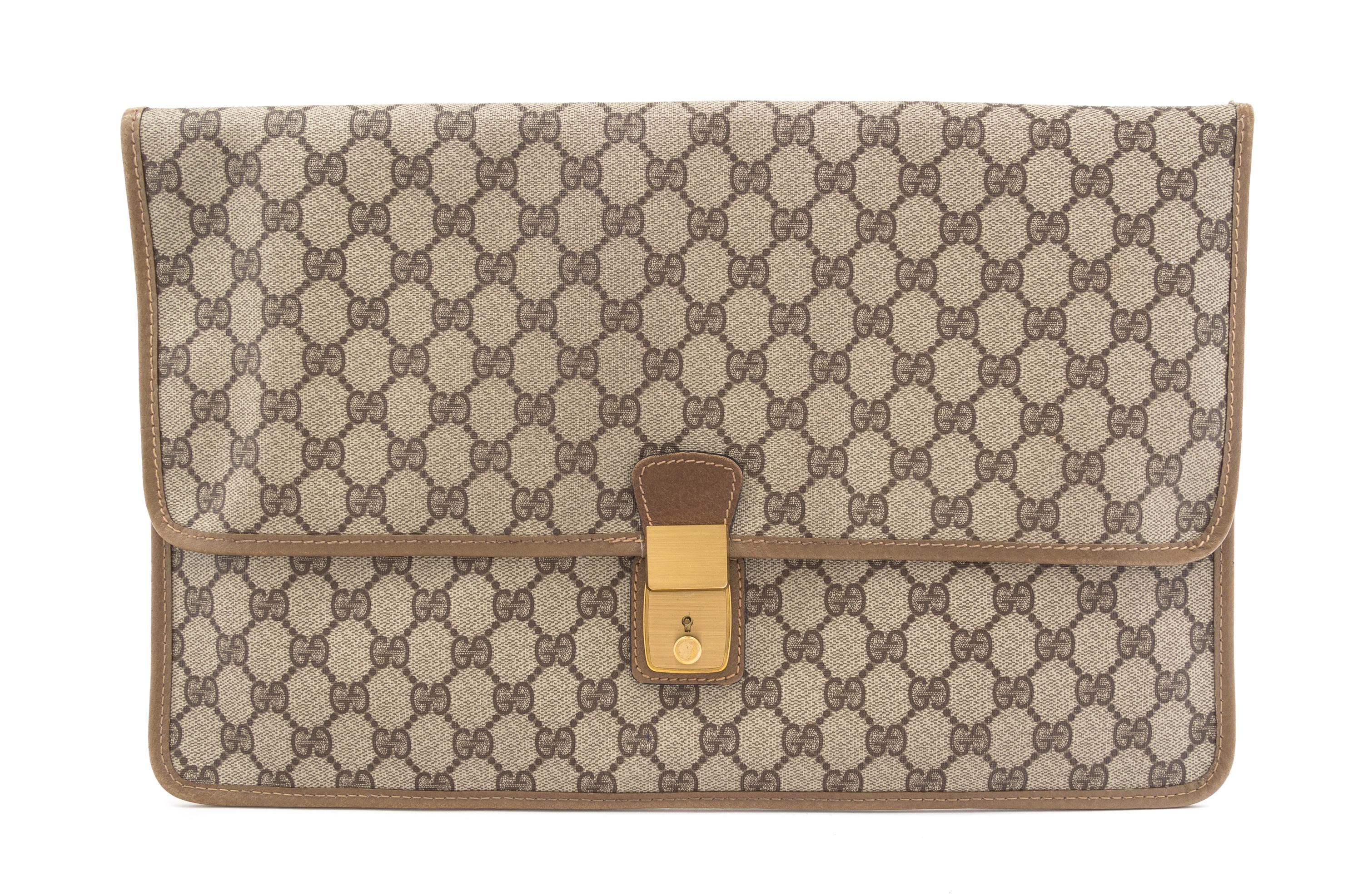 A Gucci Monogram Canvas Folio, 16" x 10".