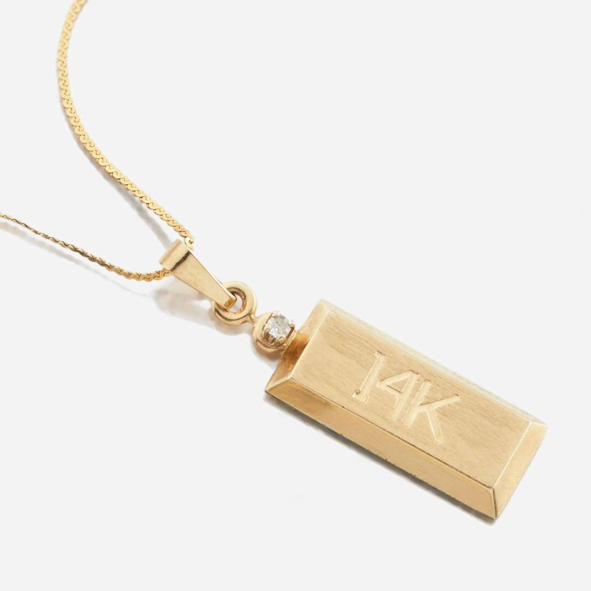 A collection of four gold necklaces