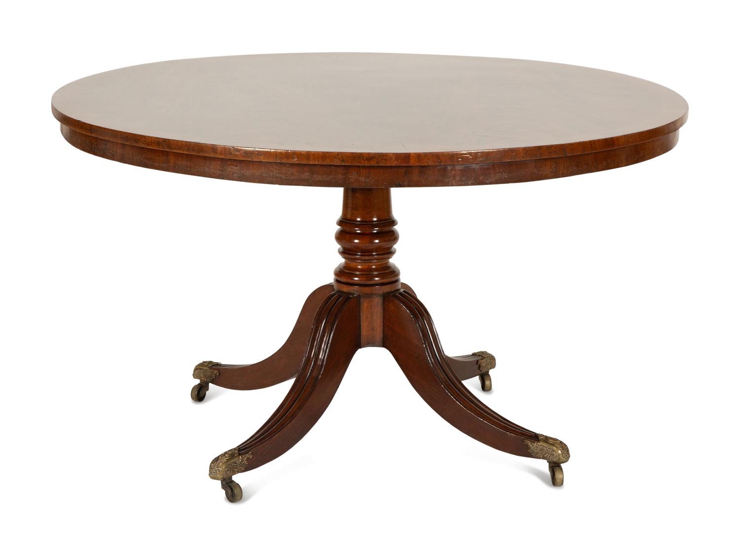 A Regency Figured Mahogany Crossbanded Center Table — 19th Century