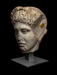 A Roman Marble Head of a Youth Wearing a Laurel Wreath