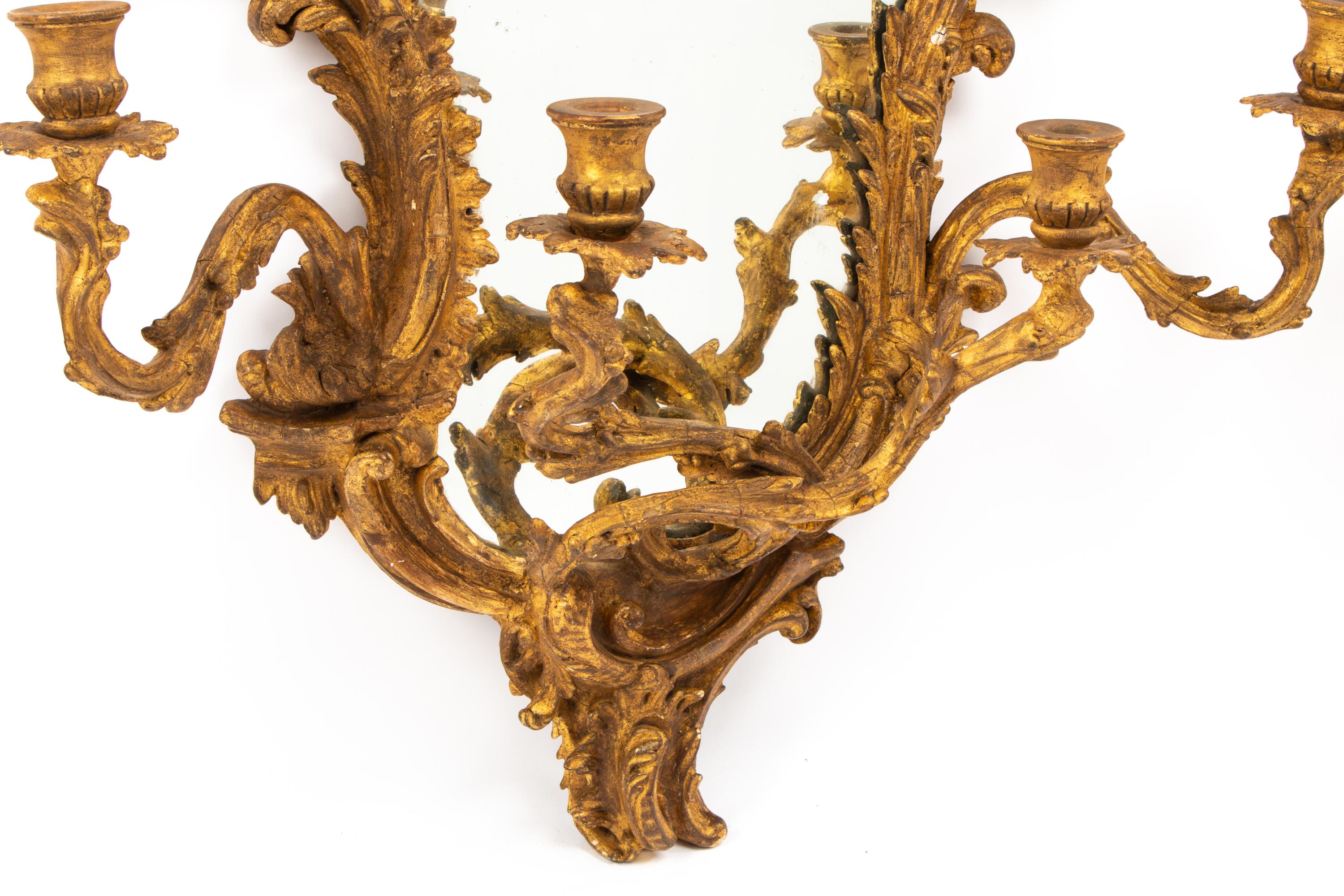 A Pair of Italian Carved Giltwood Girandole Mirrors