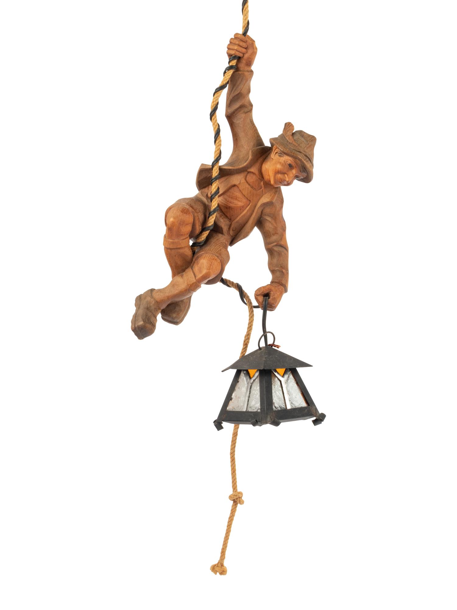 A Black Forest Carved Lindenwood 'Climber' Lamp
