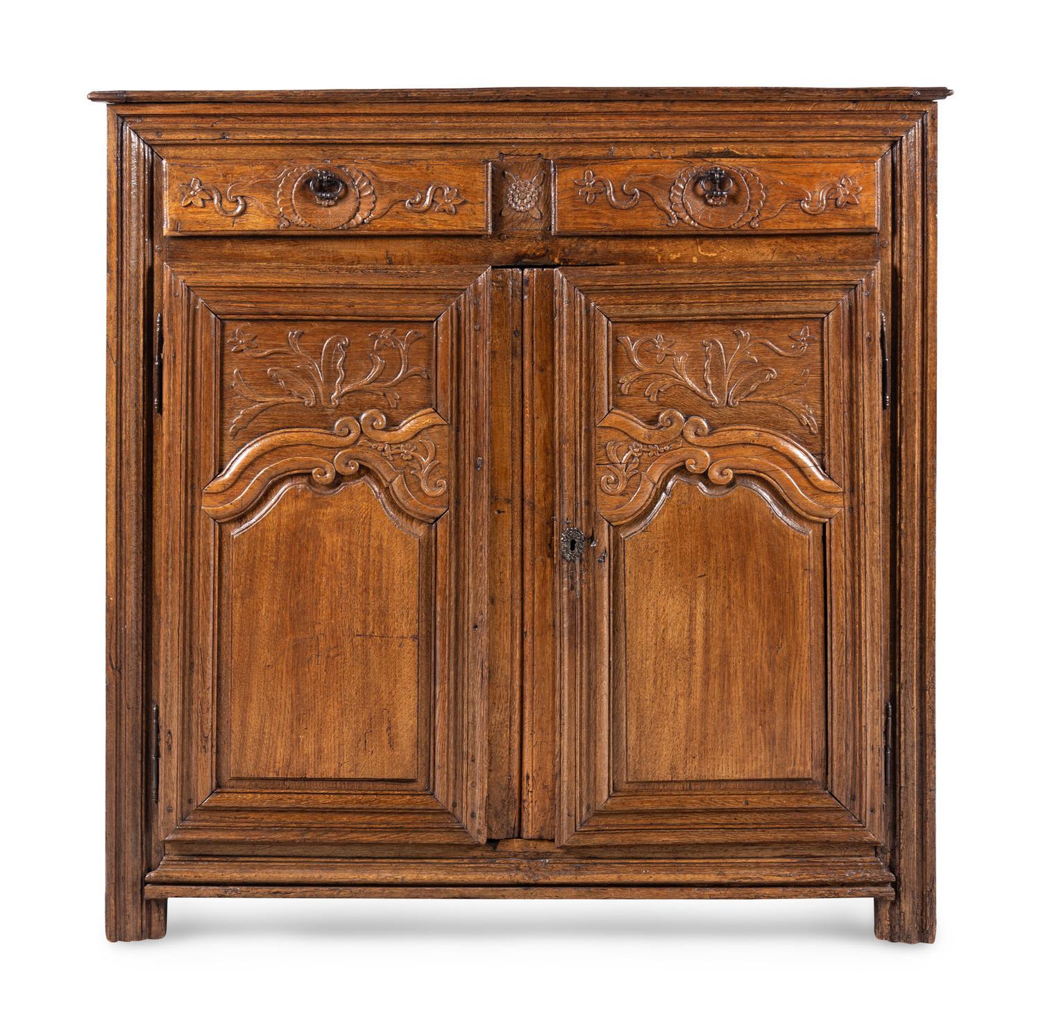 A French Provincial Carved Oak Cabinet