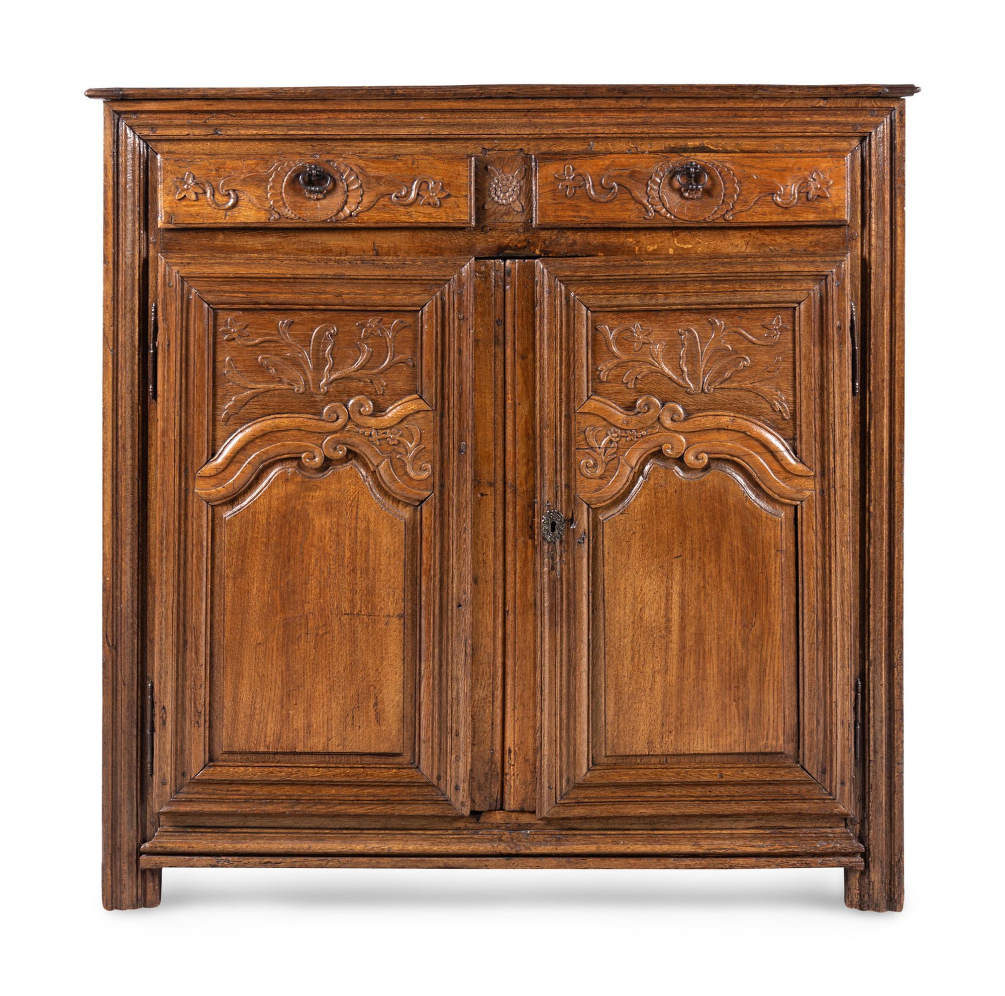 A French Provincial Carved Oak Cabinet