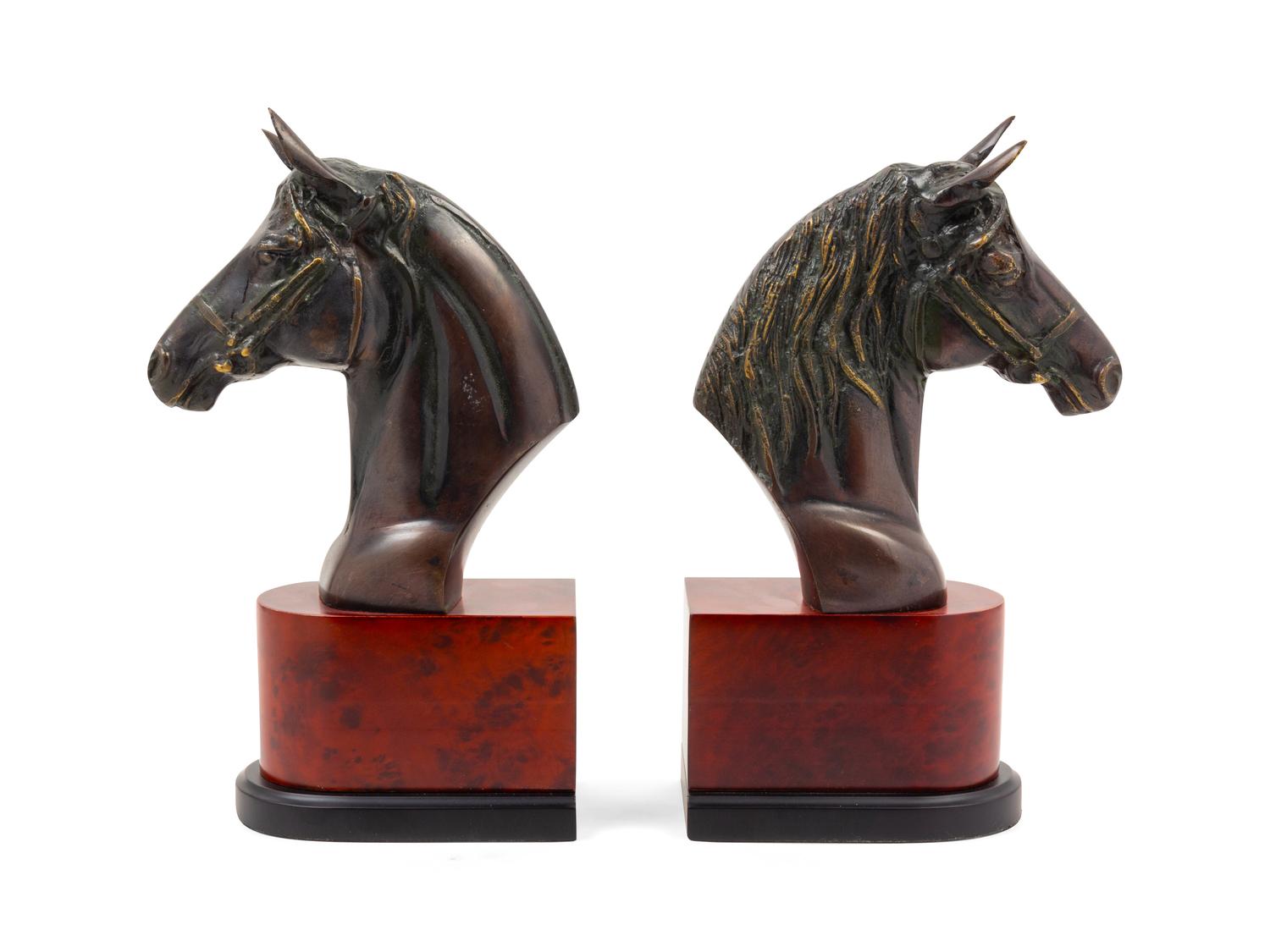 A Pair of Cast Metal Busts of Horses