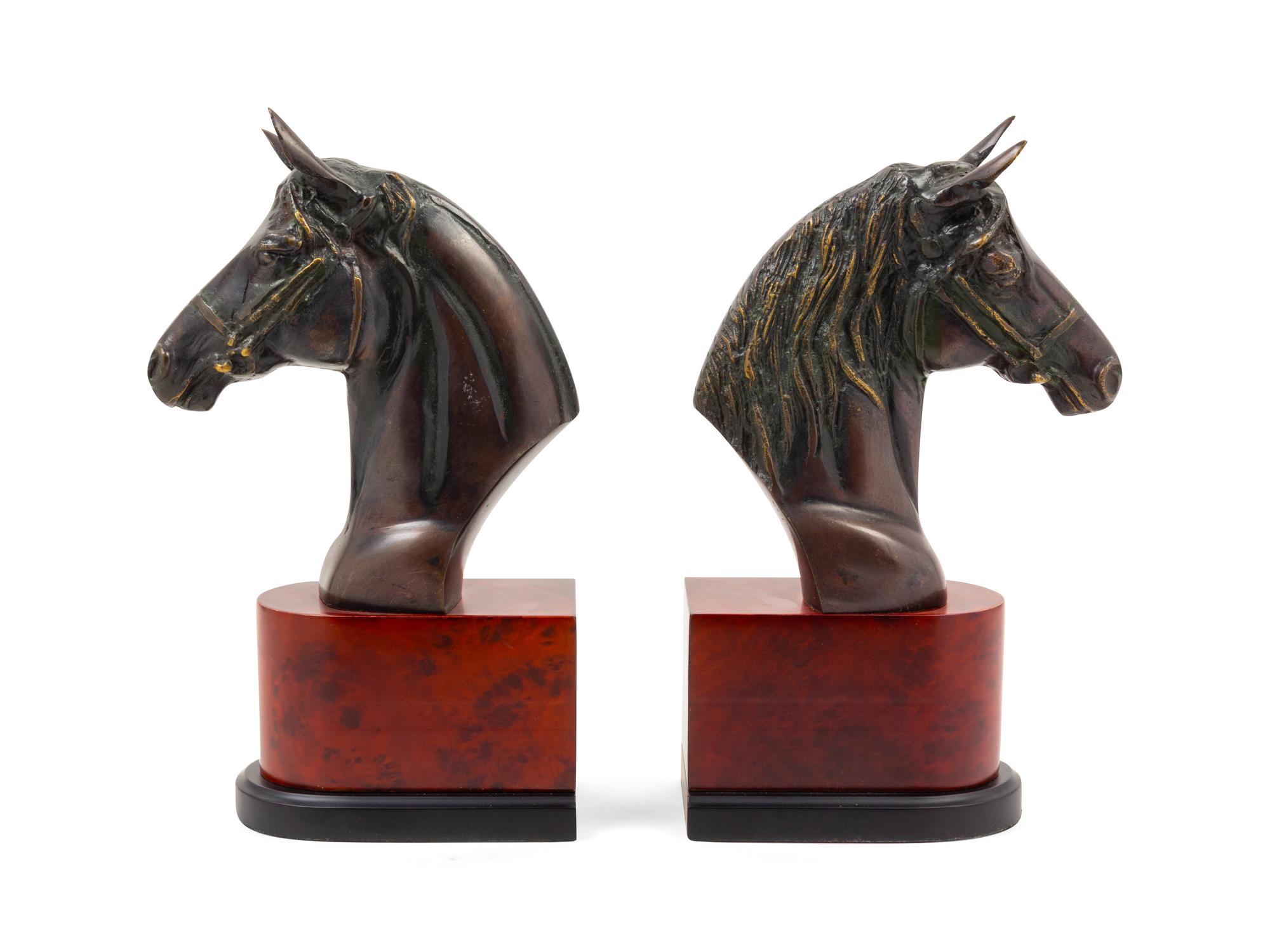 A Pair of Cast Metal Busts of Horses