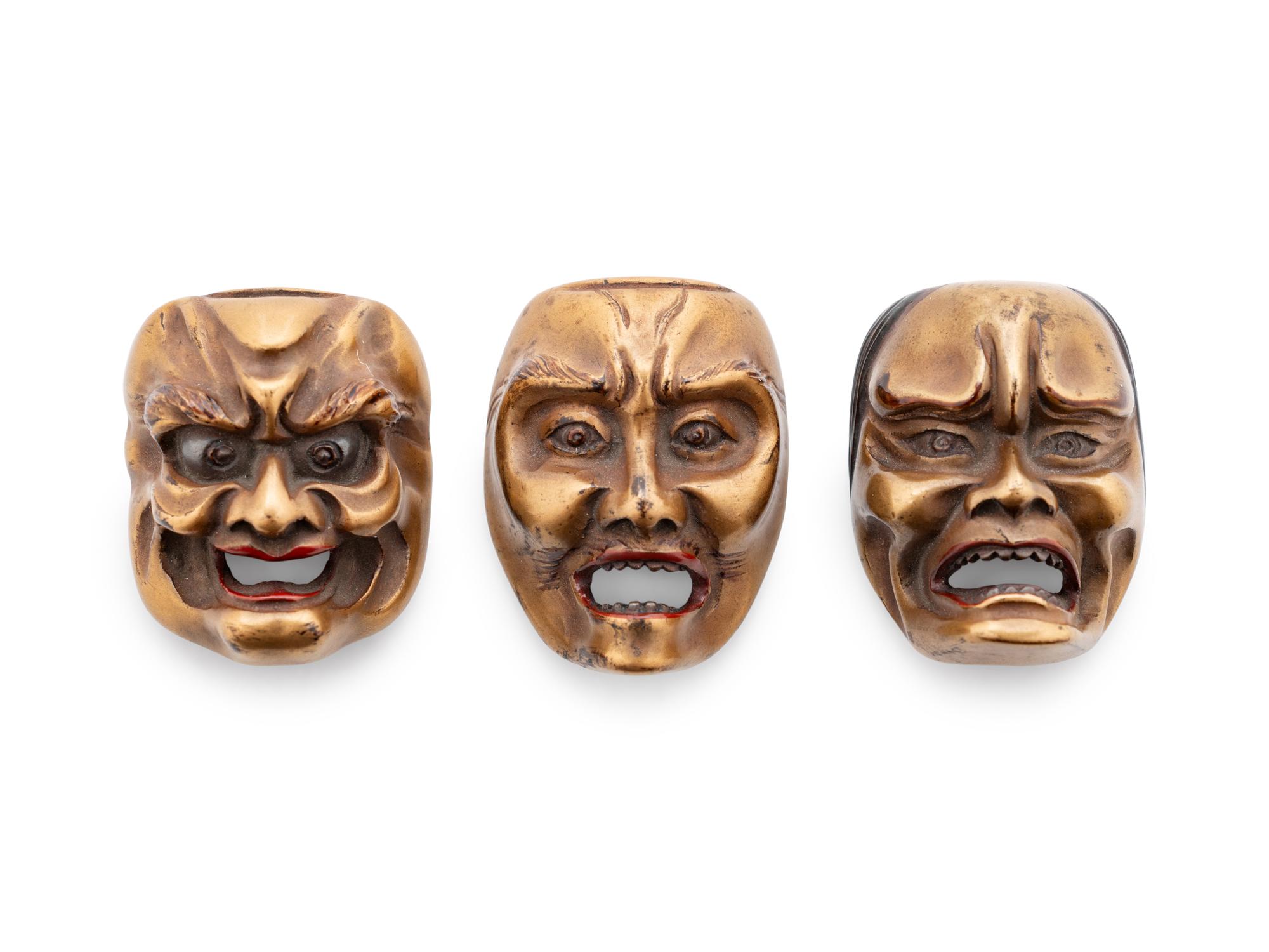 Three Gilt Lacquered Wood Mask Netsukes
