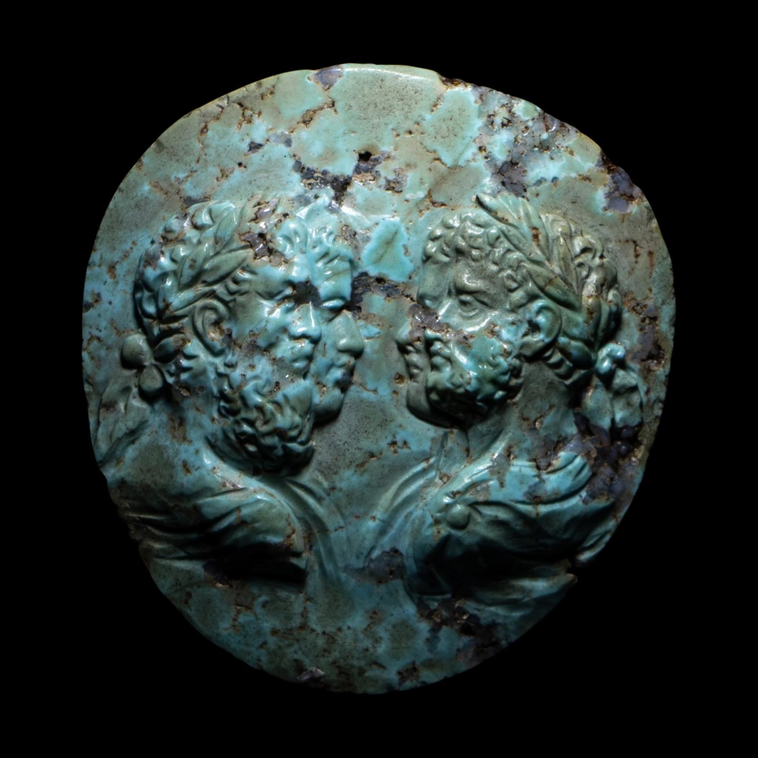 A Roman Turquoise Cameo with the Portrait Busts of the Severan Imperial Family