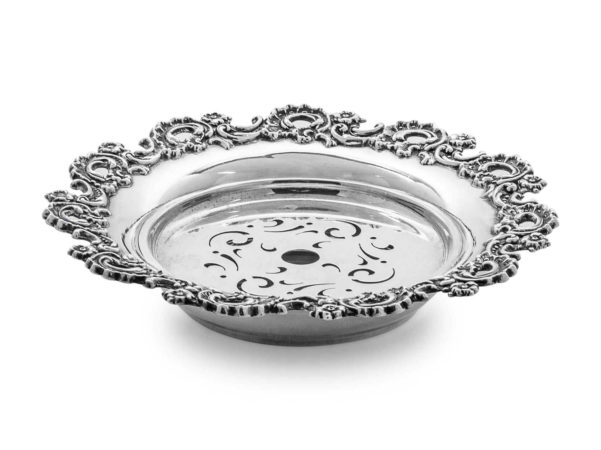 having a foliate decorated rim, with insert.
