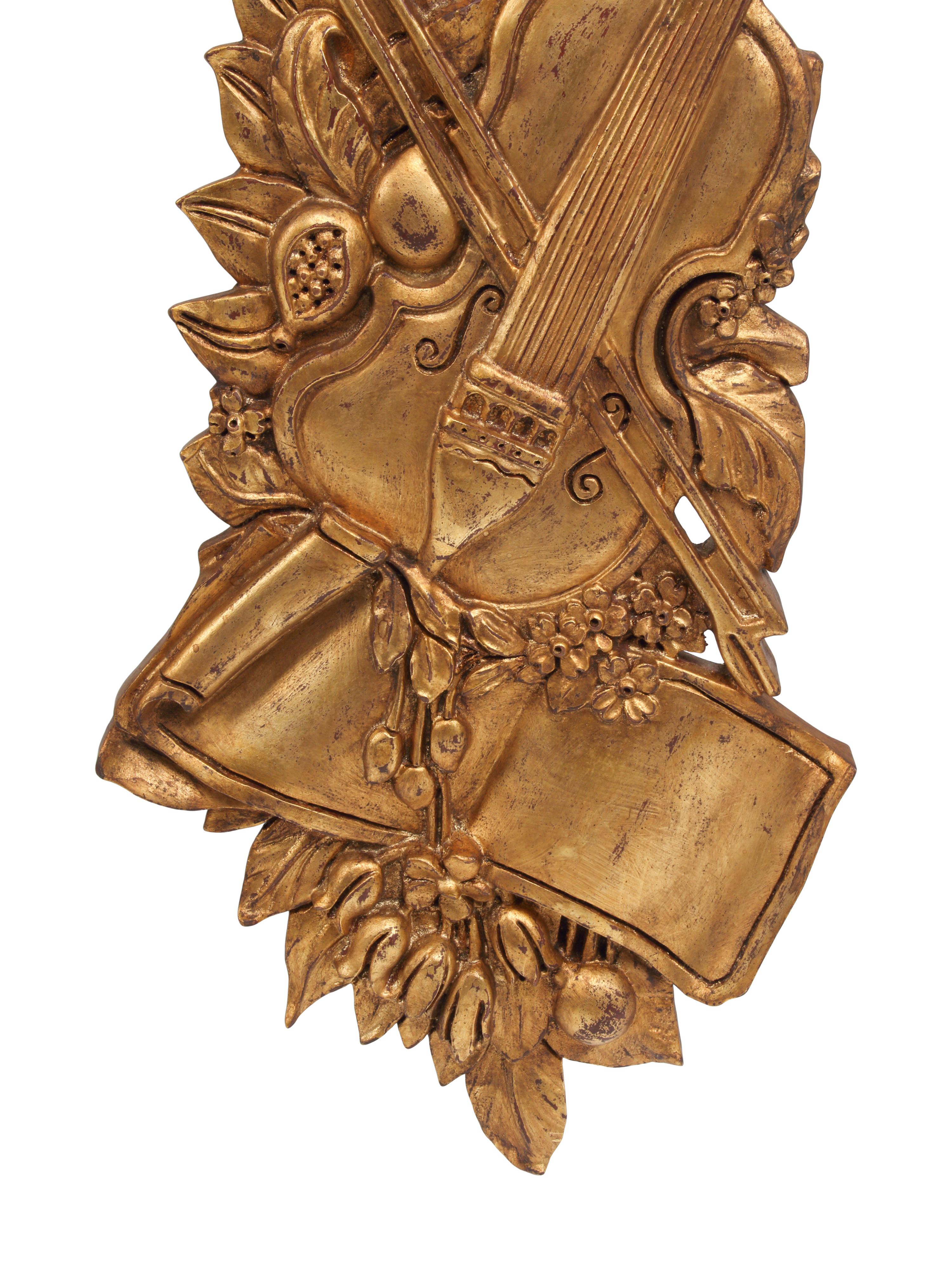 A Set of Four Giltwood Wall Trophies