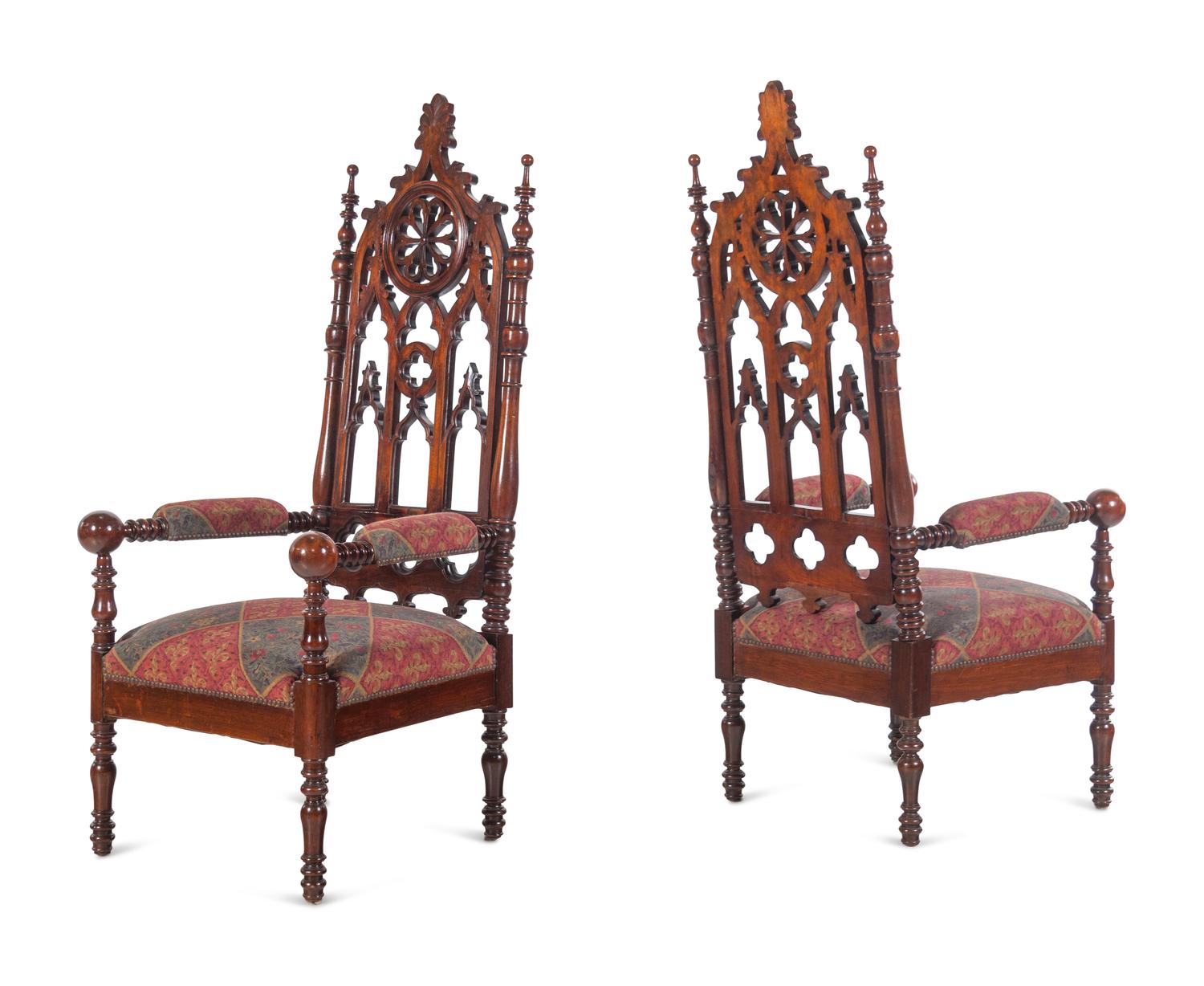 A Pair of Gothic Revival Carved Walnut Armchairs
