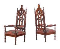 A Pair of Gothic Revival Carved Walnut Armchairs