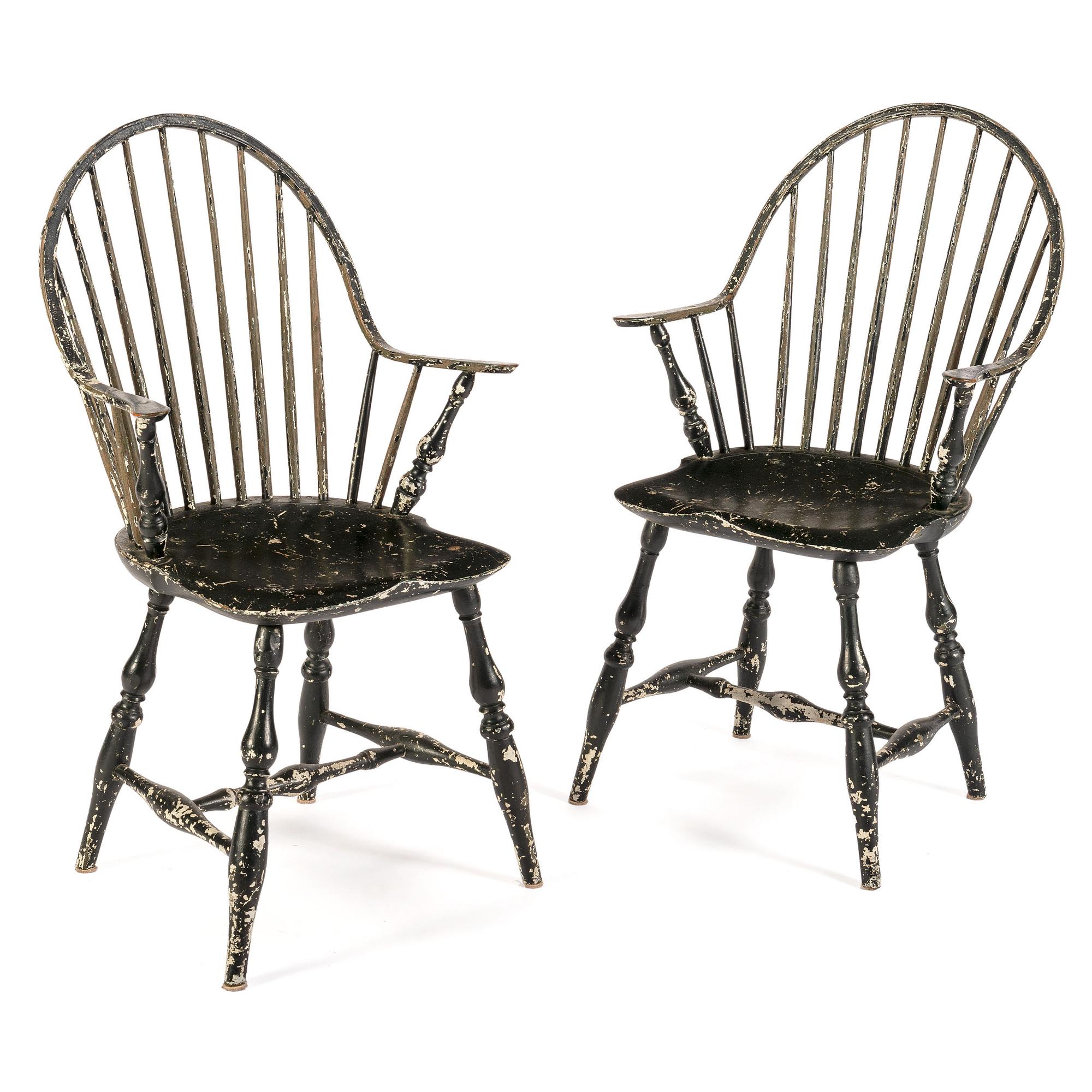 A Pair of Black-Painted Continuous Arm Windsor Chairs