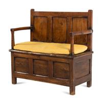An English Carved Oak Settle