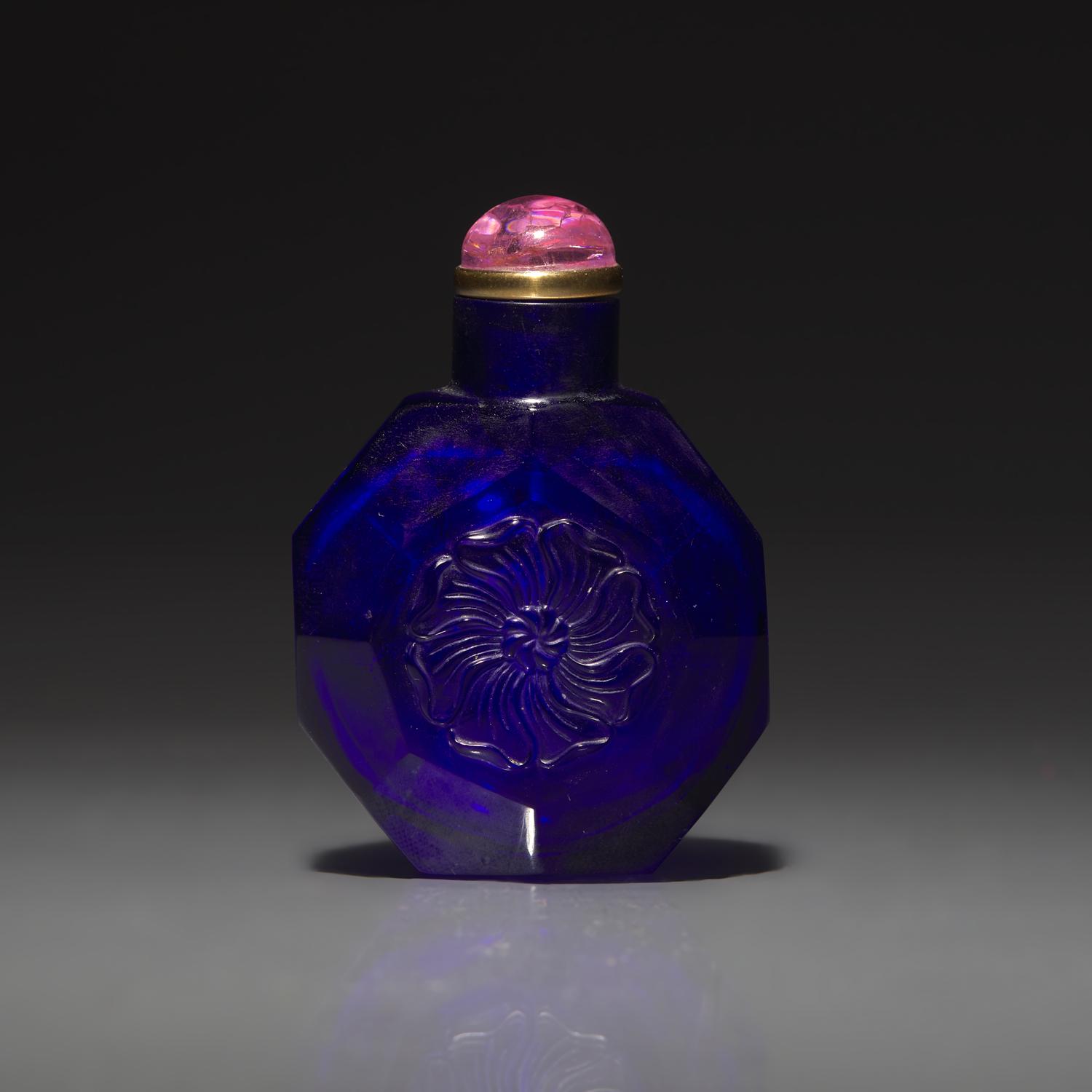 A Chinese Carved Cobalt Blue Glass Snuff Bottle, 18th Century 清中期 寶石藍料刻花鼻烟壺