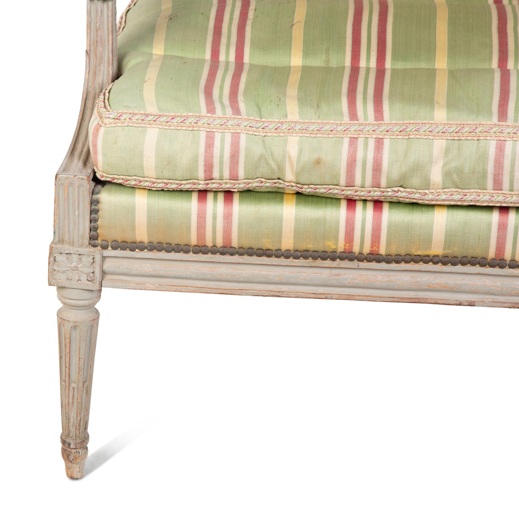 A Louis XVI Style Painted Fauteuil — 18TH/19TH CENTURY