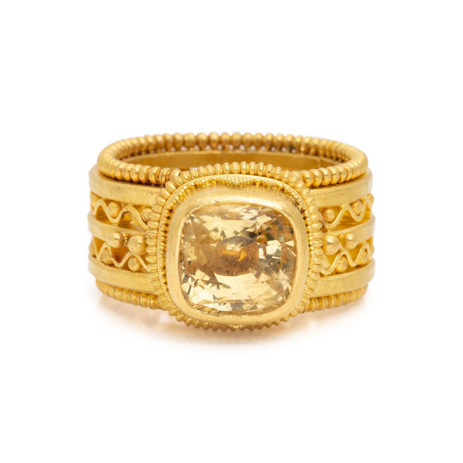 HIGH KARAT GOLD AND YELLOW SAPPHIRE RING