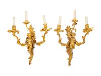 A Pair of Louis XV Style Gilt Bronze Figural Three-Light Sconces