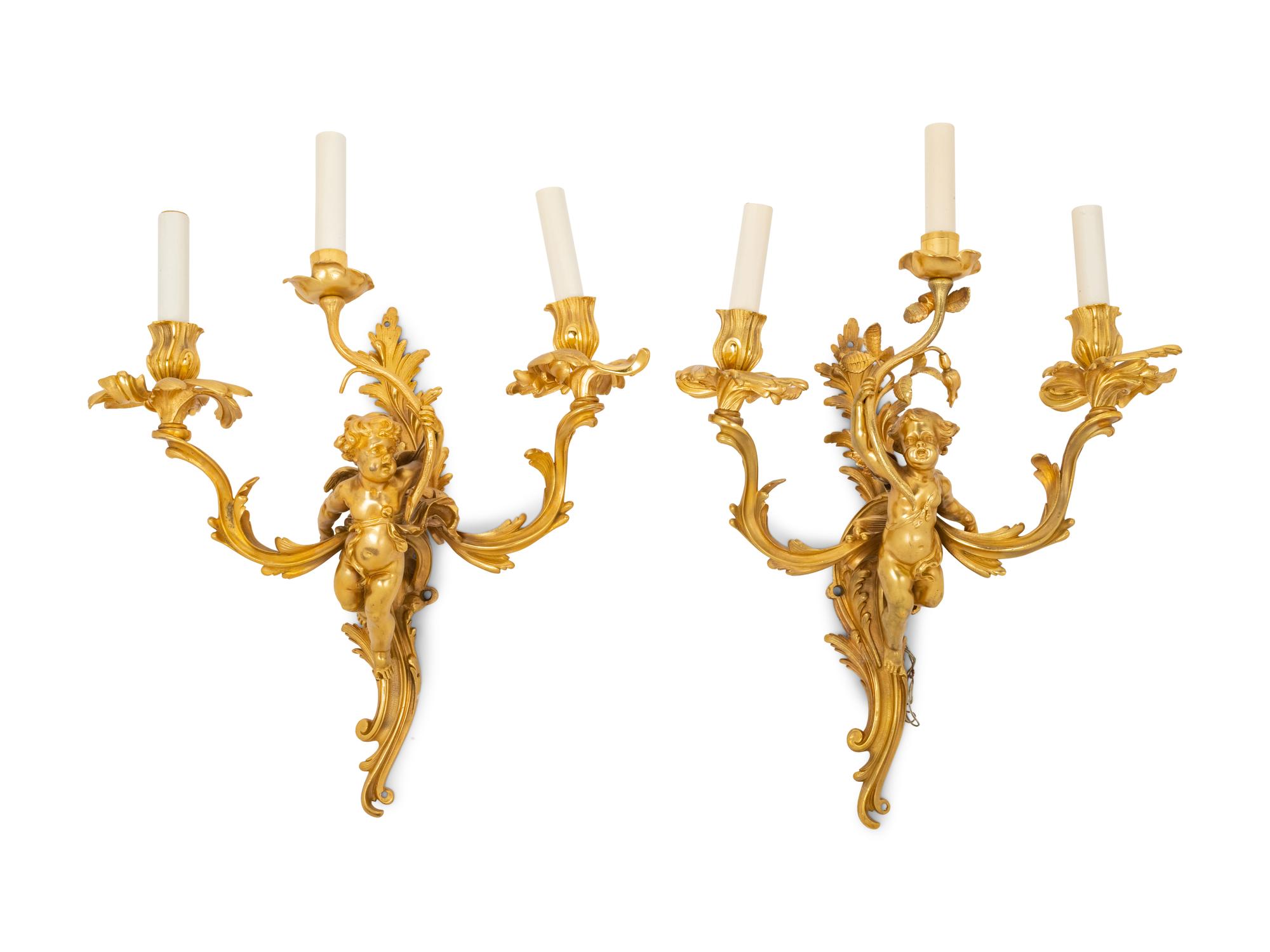A Pair of Louis XV Style Gilt Bronze Figural Three-Light Sconces