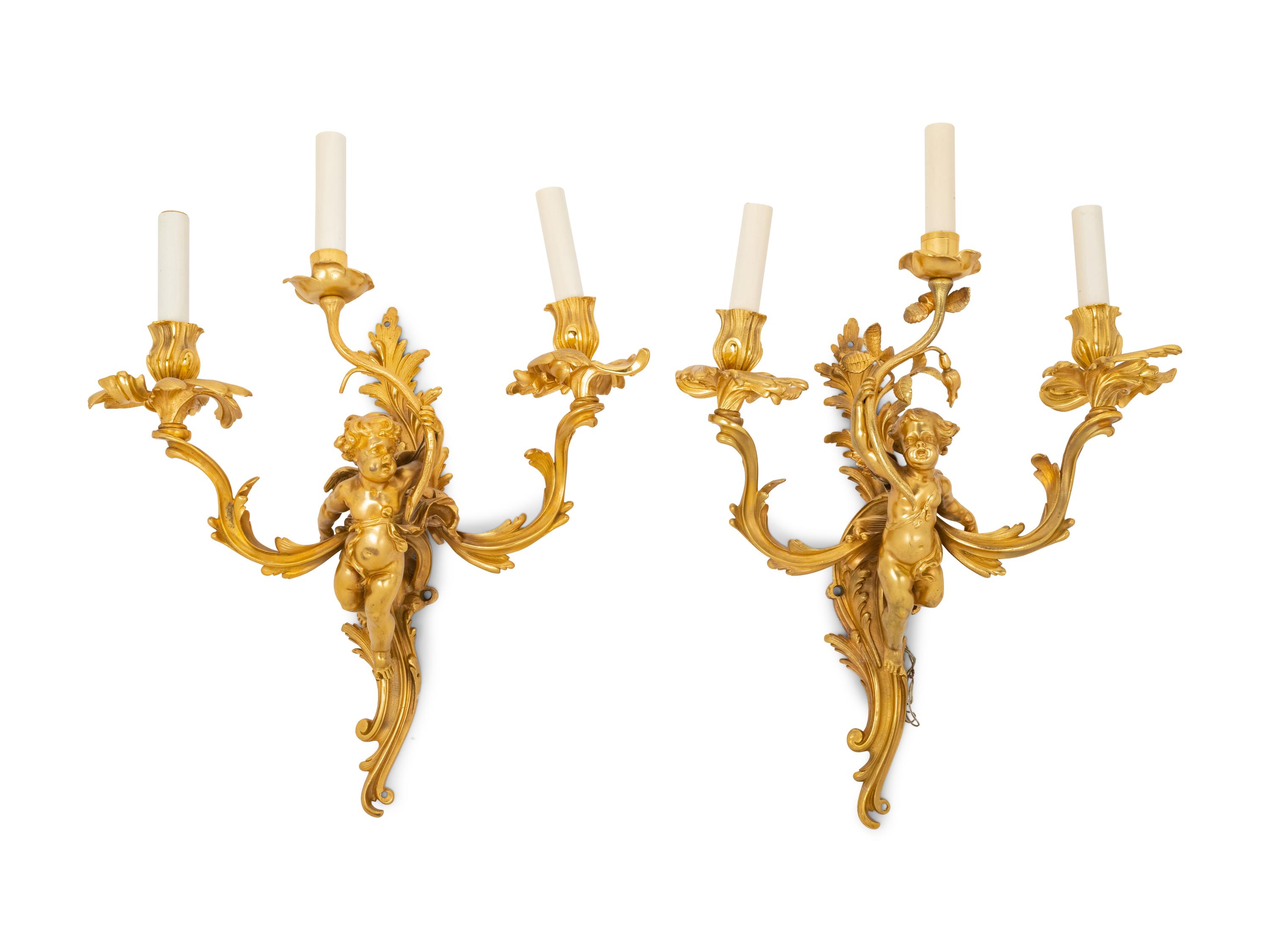 A Pair of Louis XV Style Gilt Bronze Figural Three-Light Sconces