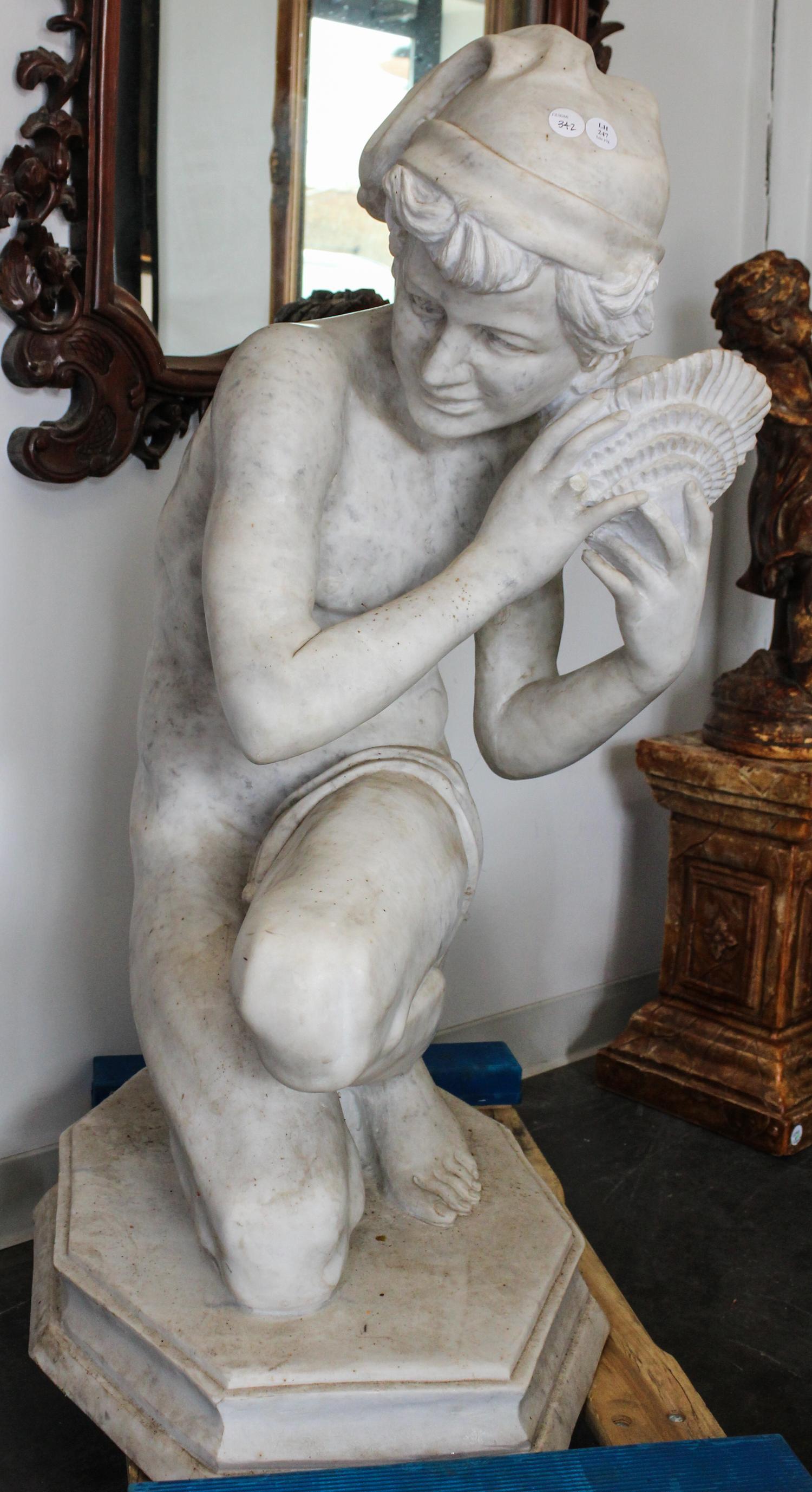 A Continental Carved Marble Figure. Height 40 inches.