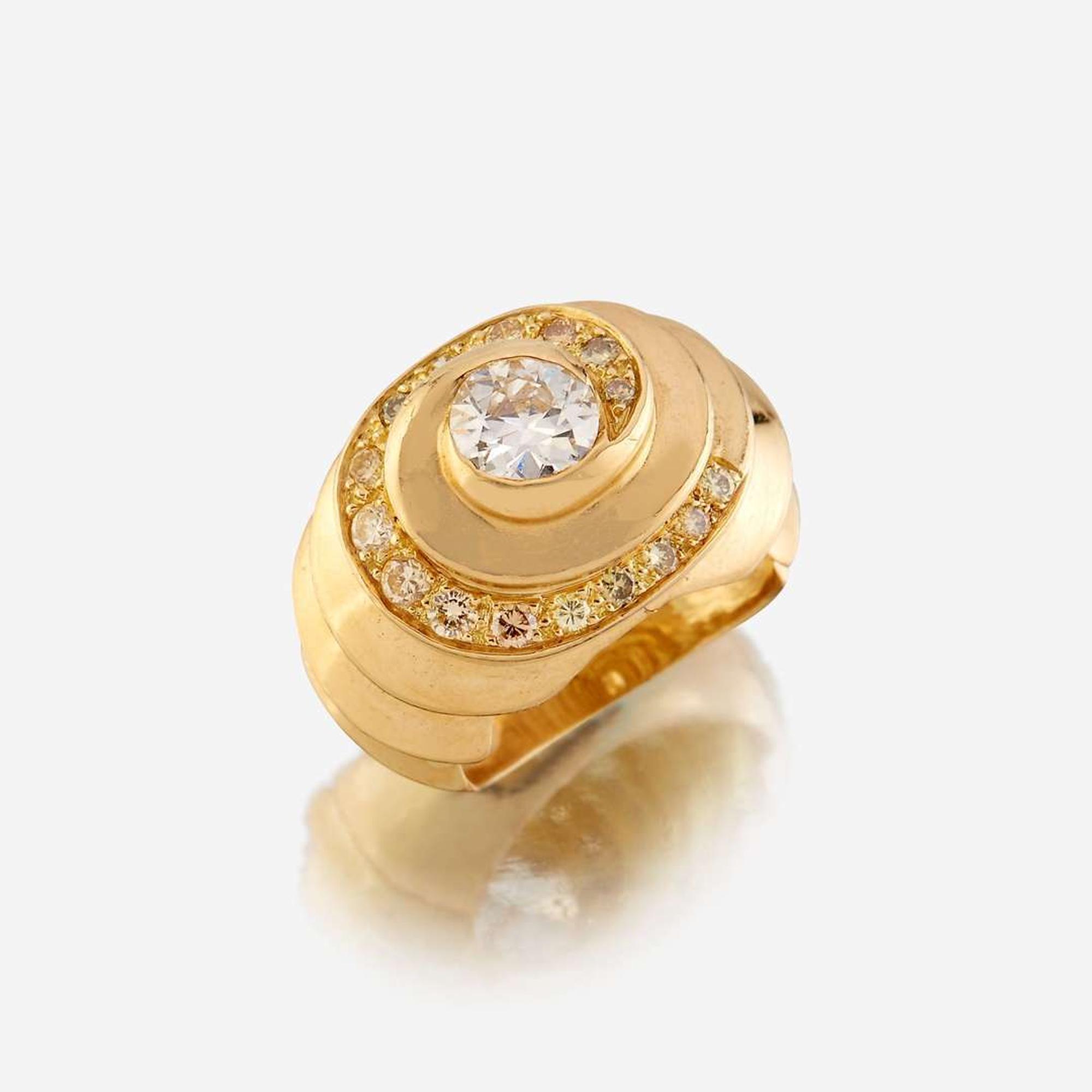 A diamond, colored diamond, and eighteen karat gold ring